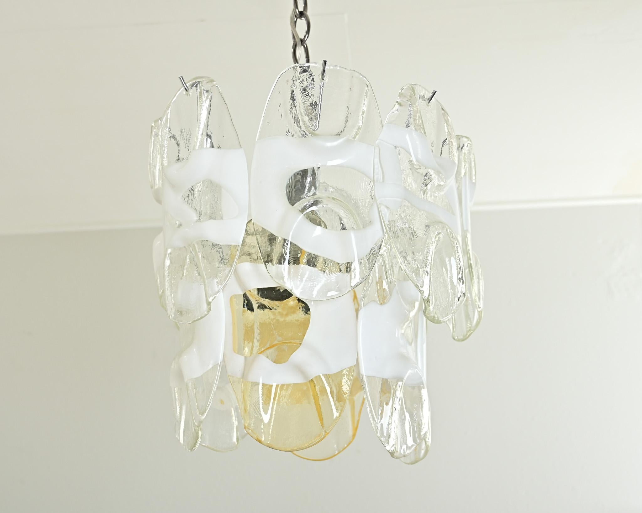 Fabulous vintage Italian Murano glass chandelier circa 1960 in the style of Gino Vistosi composed of a two-tiered frame with oval glass drops streaked with white. Artistic expression is seen in the way each glass pendant was shaped by hand to impart