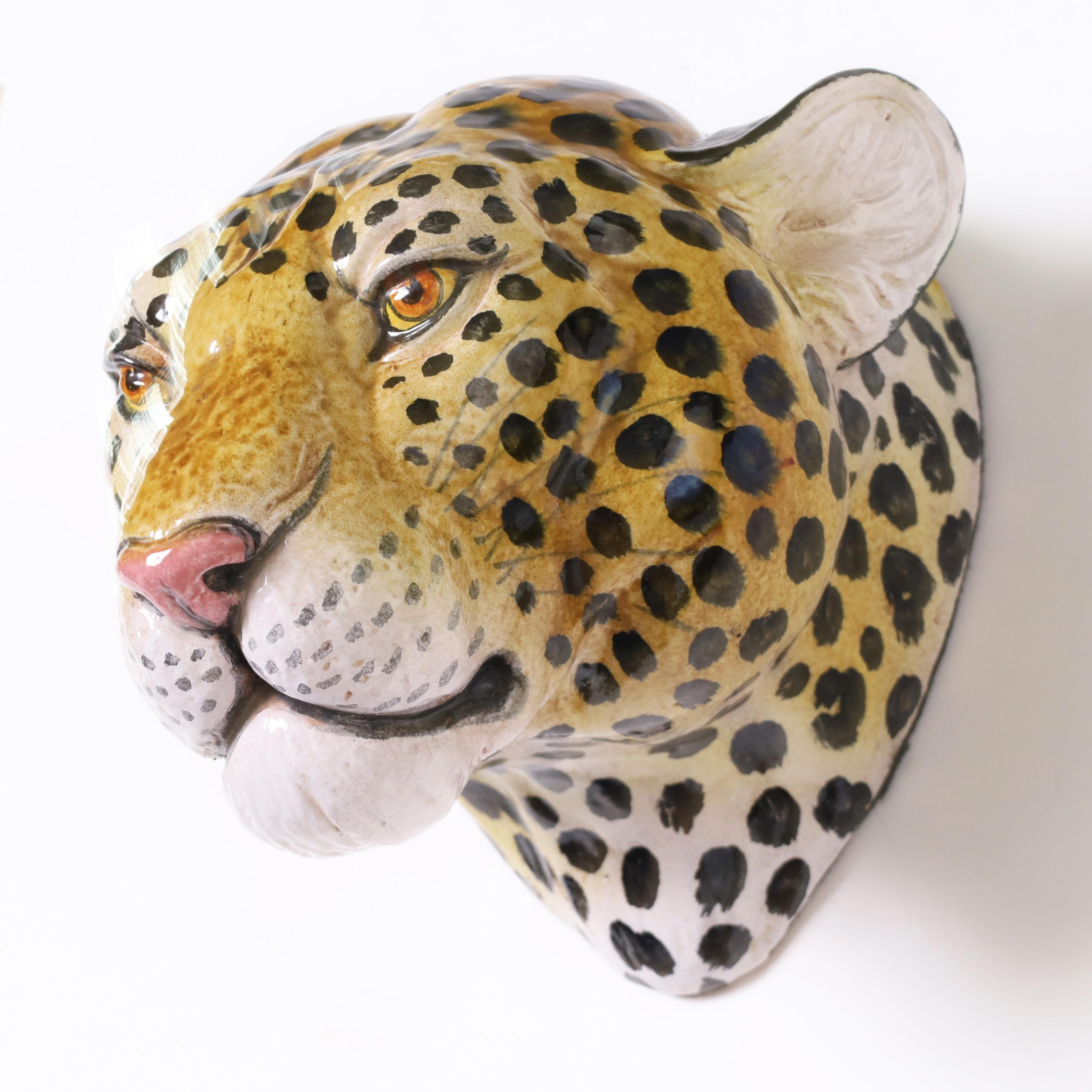 Handsome mid century Italian leopard head crafted in terra cotta and hand decorated under glaze.