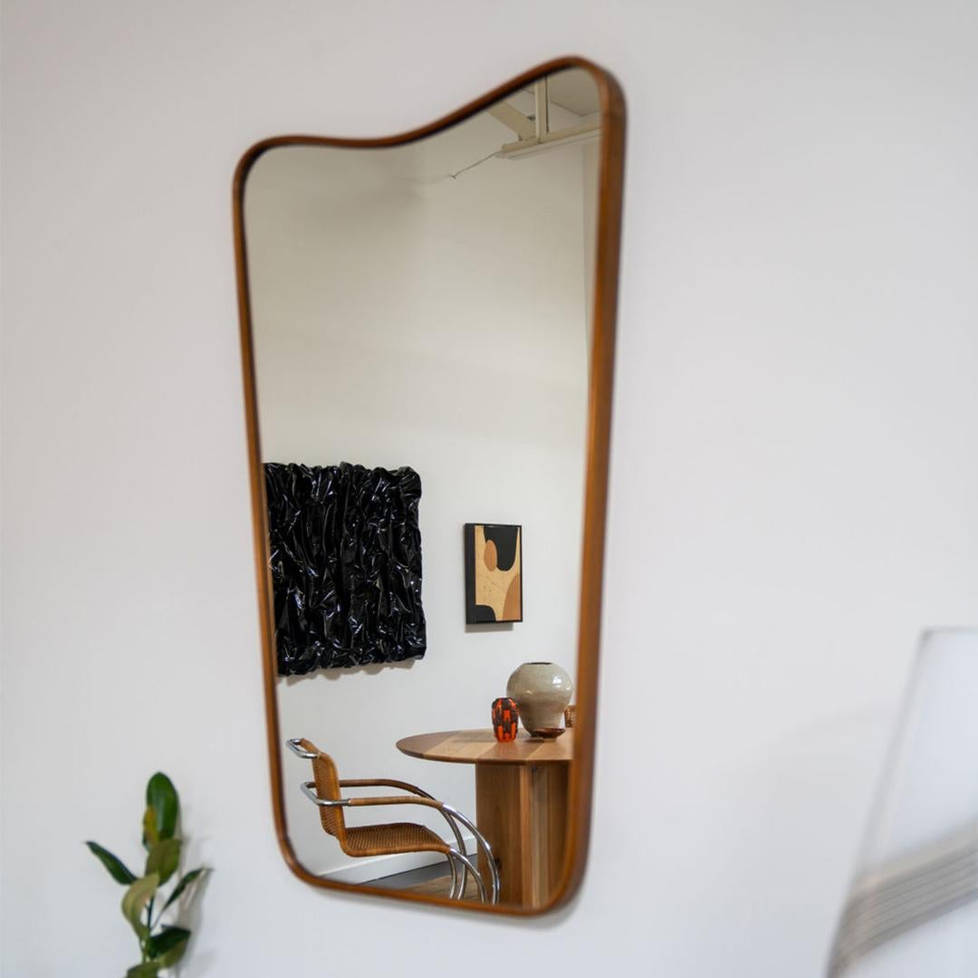 A vintage Italian mirror from with a solid walnut frame. It’s elegant lines and timeless beauty make it the ideal complement to any space

This is a rare find as mirrors made during this time were typically fabricated with metal frames. 