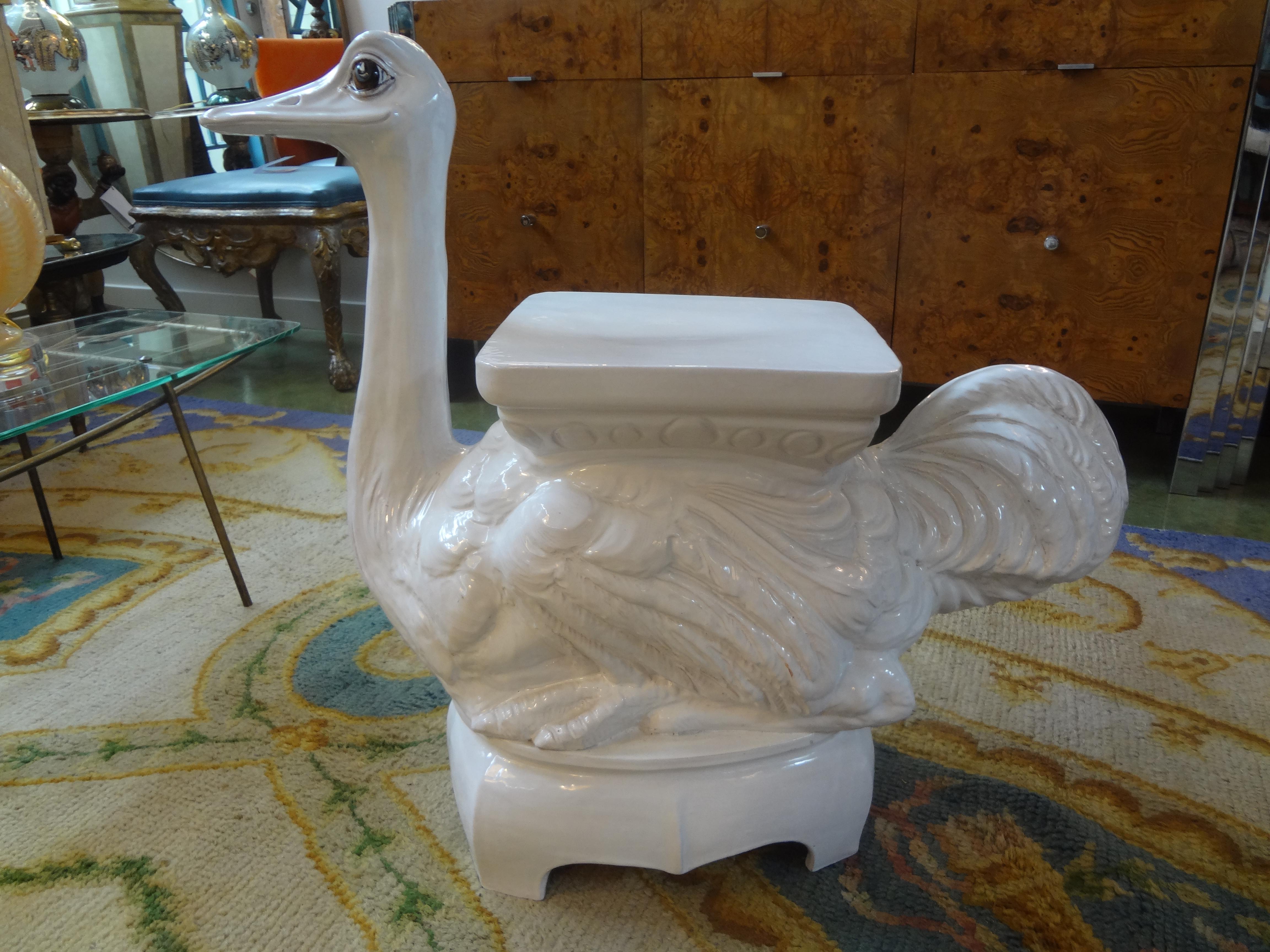 Most unusual and whimsical Italian white glazed terracotta garden seat or garden stool of an ostrich. This blanc de chine garden ornament can be used indoors or outdoors as a side table or end table. A versatile Italian Hollywood Regency piece that