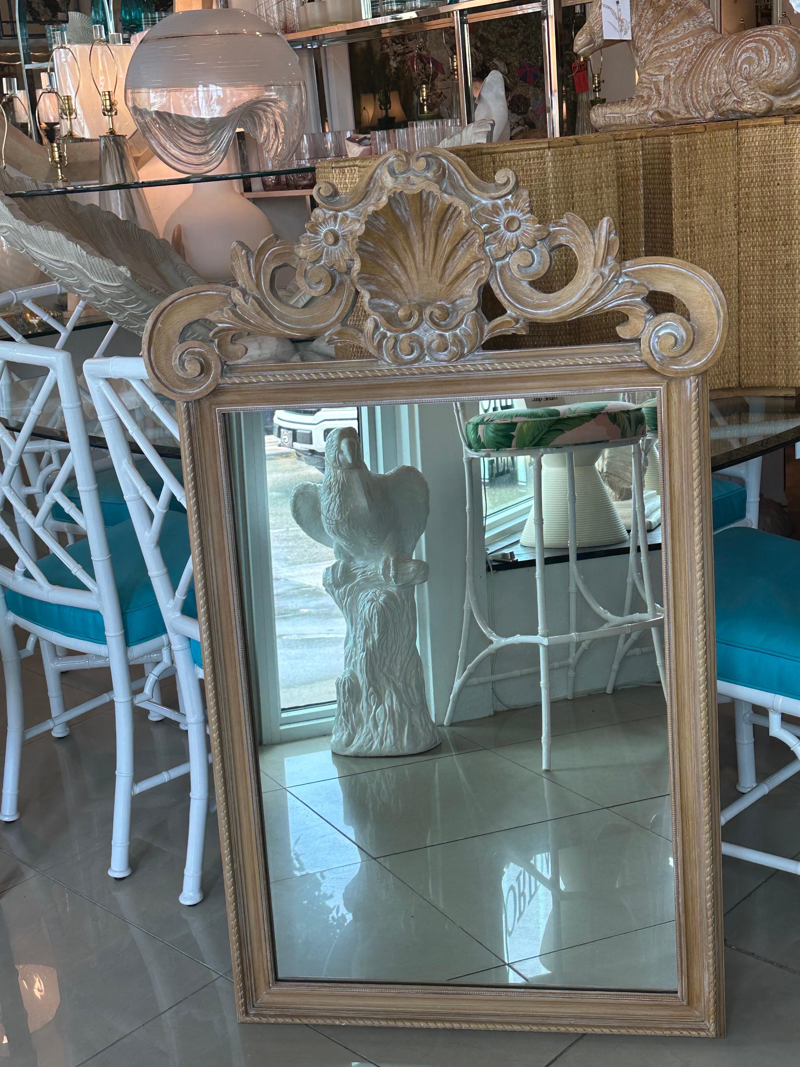Lovely vintage Italian wood carved shell seashell, scalloped clamshell, wall mirror. All new hardware has been installed for hanging. New mirror insert. Dimensions: 45.5 H x 28.25 W x 2 D.