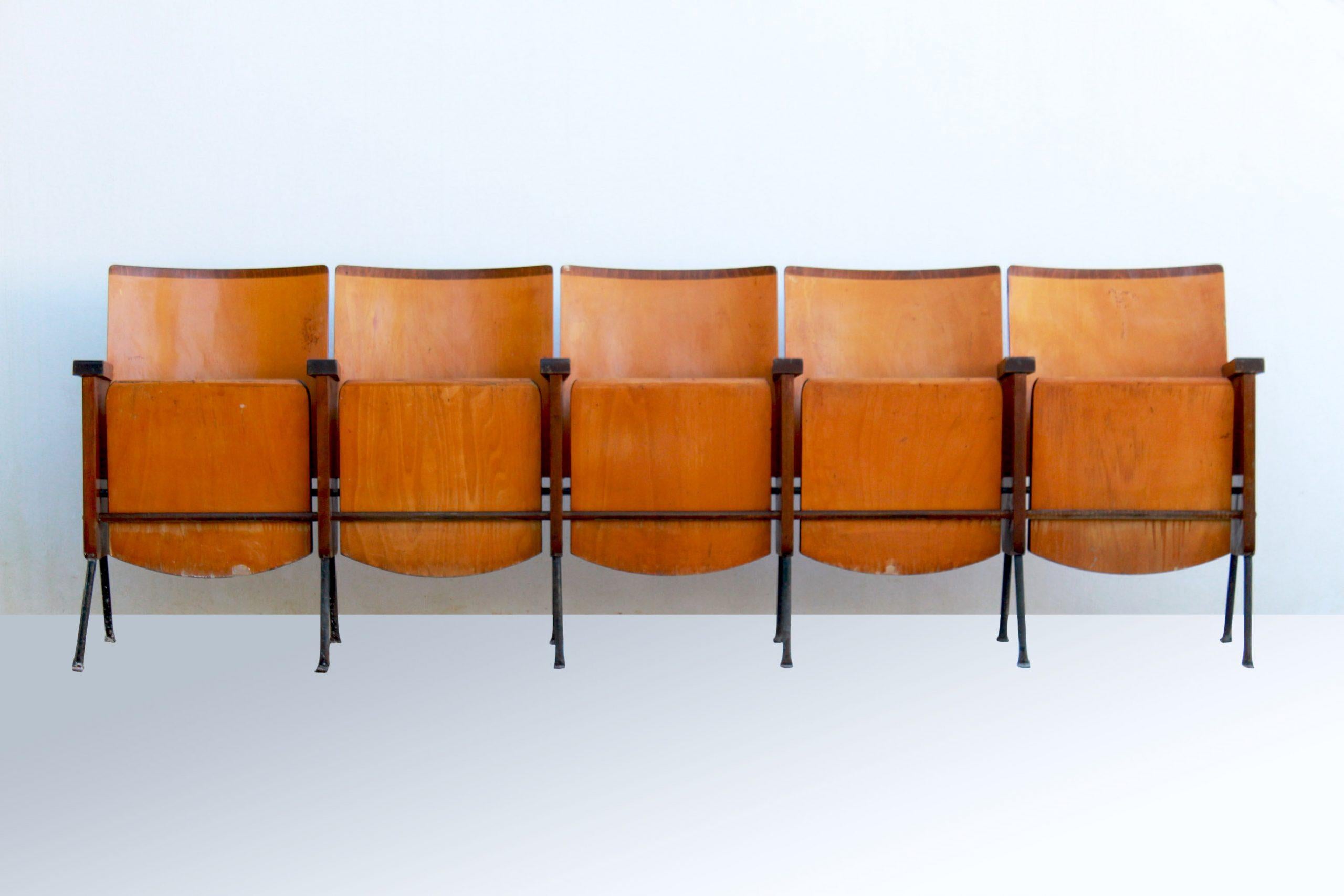 1950s cinema bench/ chairs, in pure midcentury style. In good conditions as the item has been renovated. Only few small signs of age still visible. The item structure is composed by Iron and compressed wood.


 