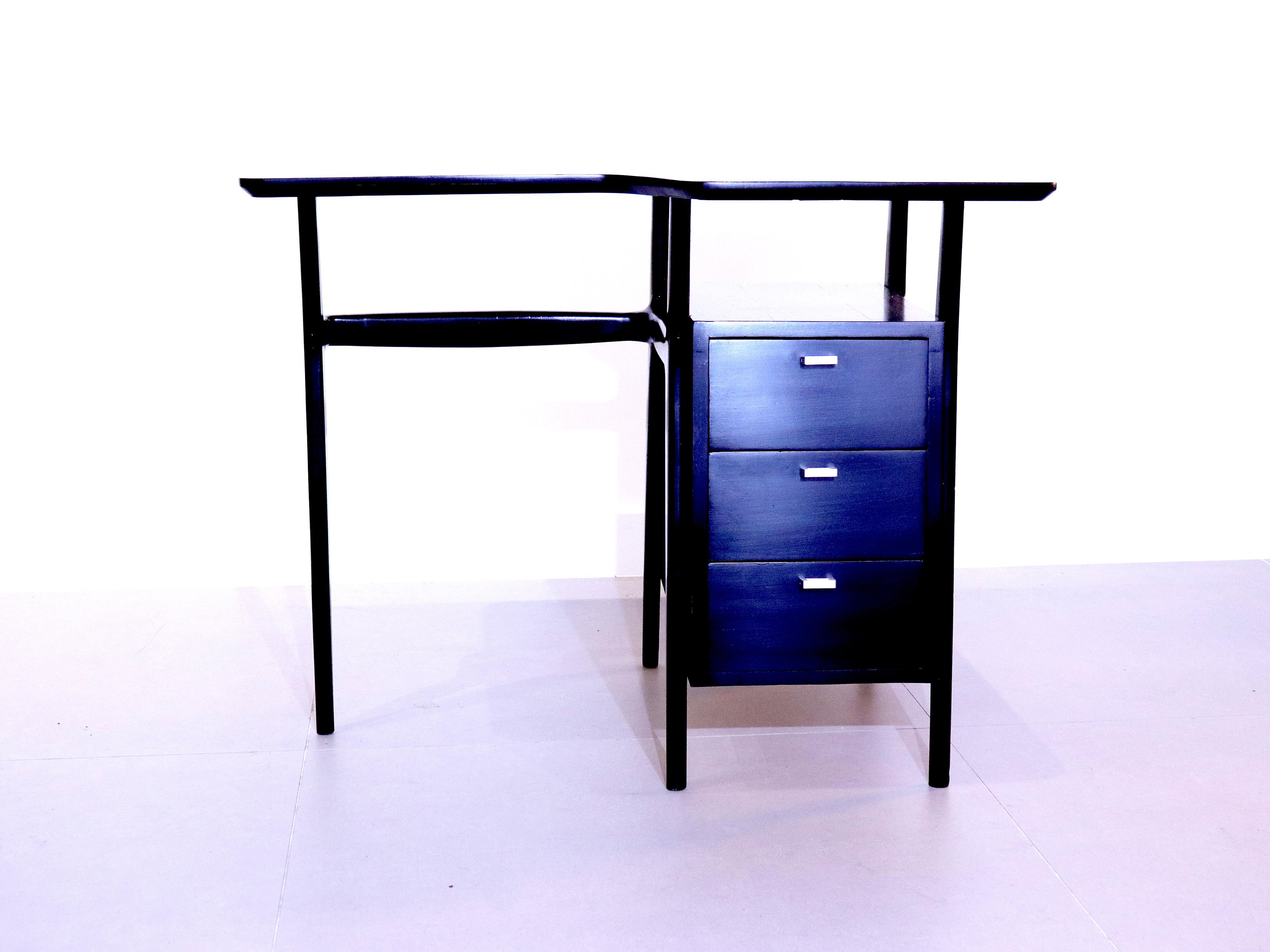 A lovely little 1950's Italian writing desk, recently ebonised.
This petite desk is perfect for smaller spaces, the three deep drawers give enough storage whilst still not taking up much space.
The metal drawer pulls give a great contrast to the