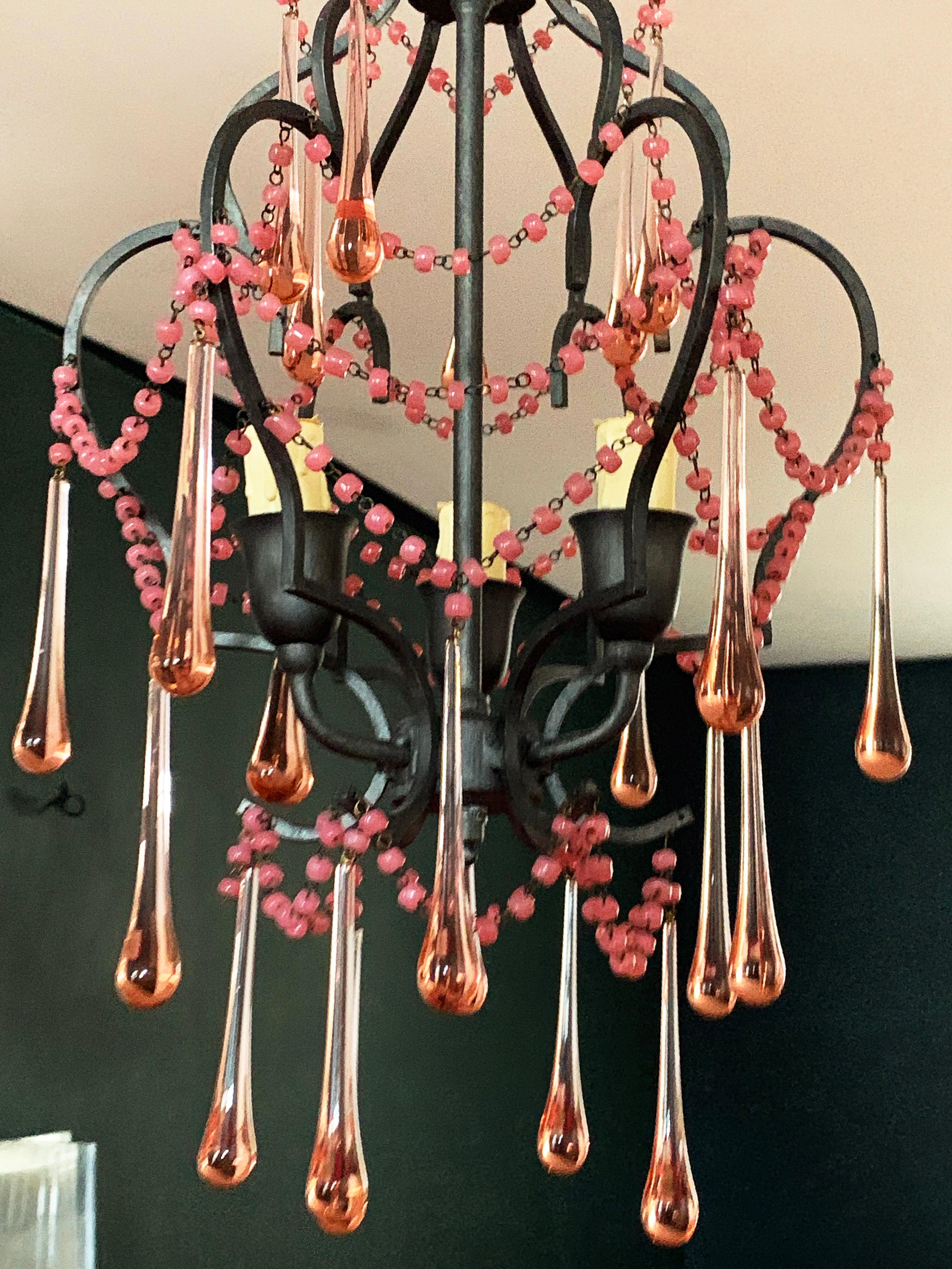 Vintage Italian wrought iron and rose drop crystal diminutive tiered chandelier. Gorgeous. Made in Italy brass label.
  
  