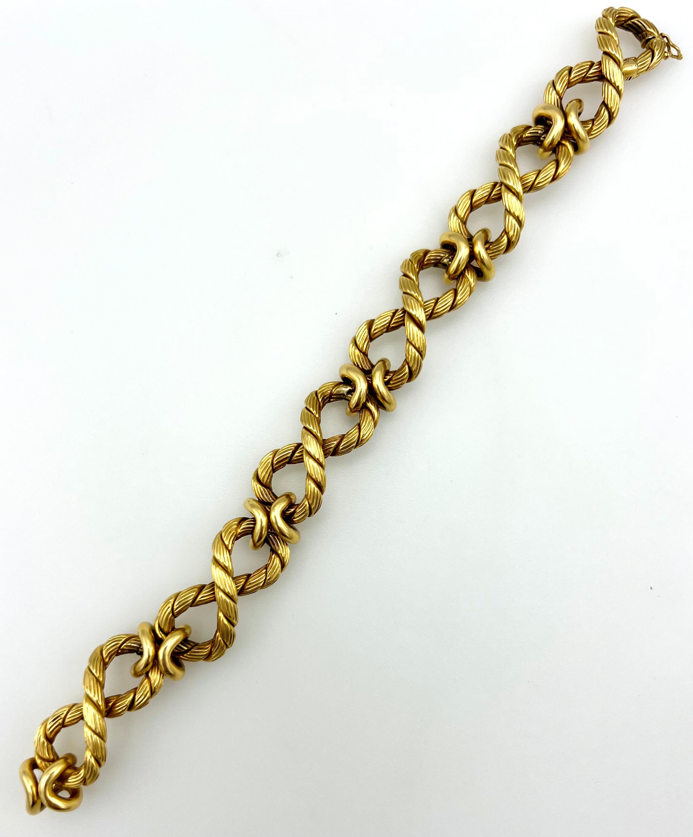 - 18 karat yellow gold
- Featuring infinity & X links 
- Rope, nautical motif
- Figure eight safety closure

Hallmarks: Italy, 18K, 15VK or VR
Total weight: 38.5 grams
Measurements: 7” long and 1/2” wide