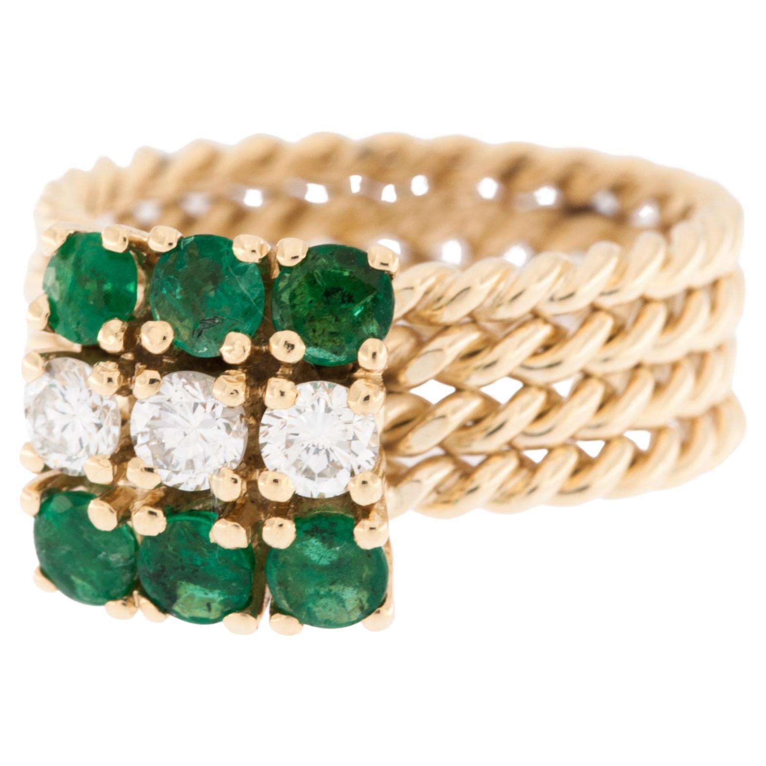 The vintage Italian Yellow Gold Ring with Emeralds and Diamonds is a stunning piece of jewelry that showcases intricate craftsmanship and elegance. This exquisite ring is crafted from high-quality yellow gold, known for its warm and rich hue that