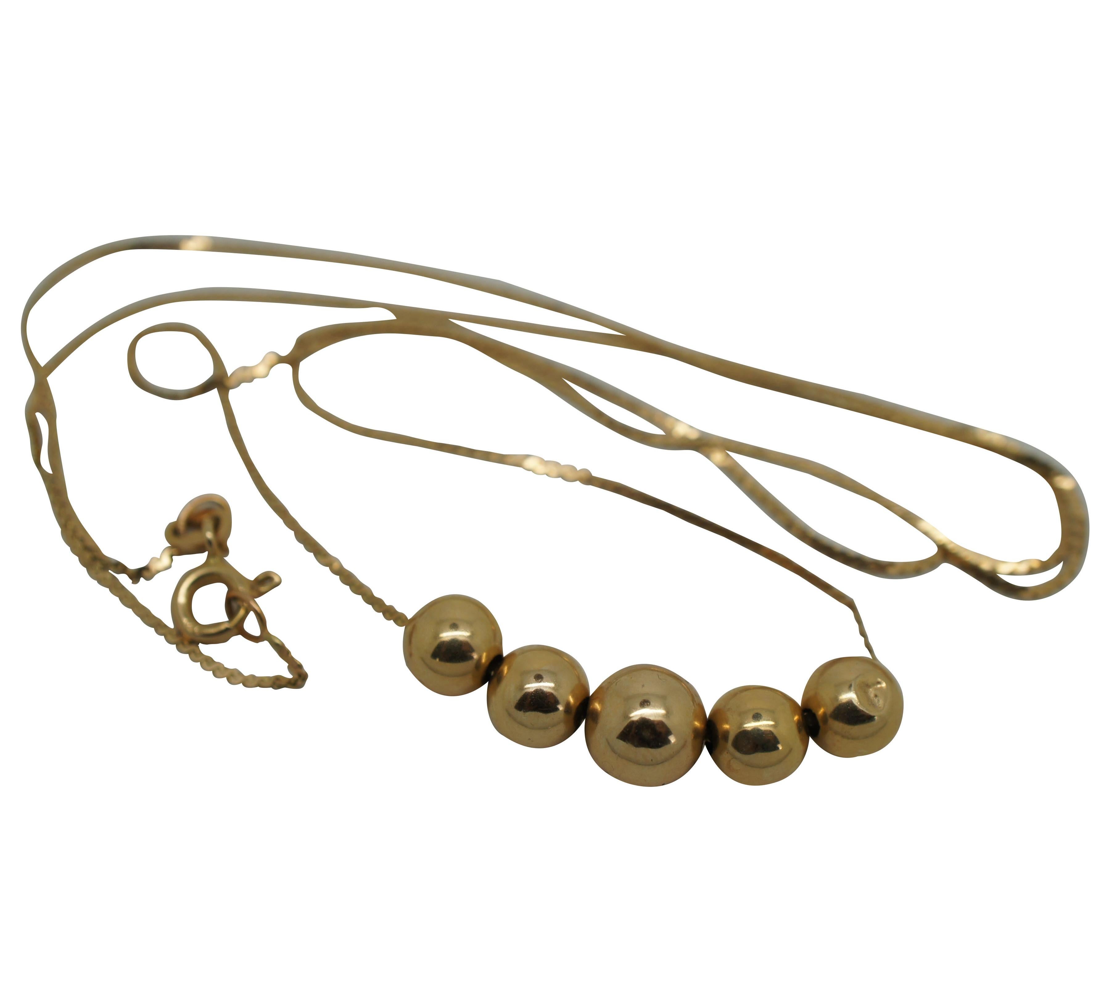 Vintage 14k yellow gold delicate serpentine chain statement necklace hung with five graduated round beads and spring ring clasp. Paired with simple hollow gold ball post back earrings. Made in Italy.

Necklace - 18” x 0.25” (Length x Width) /