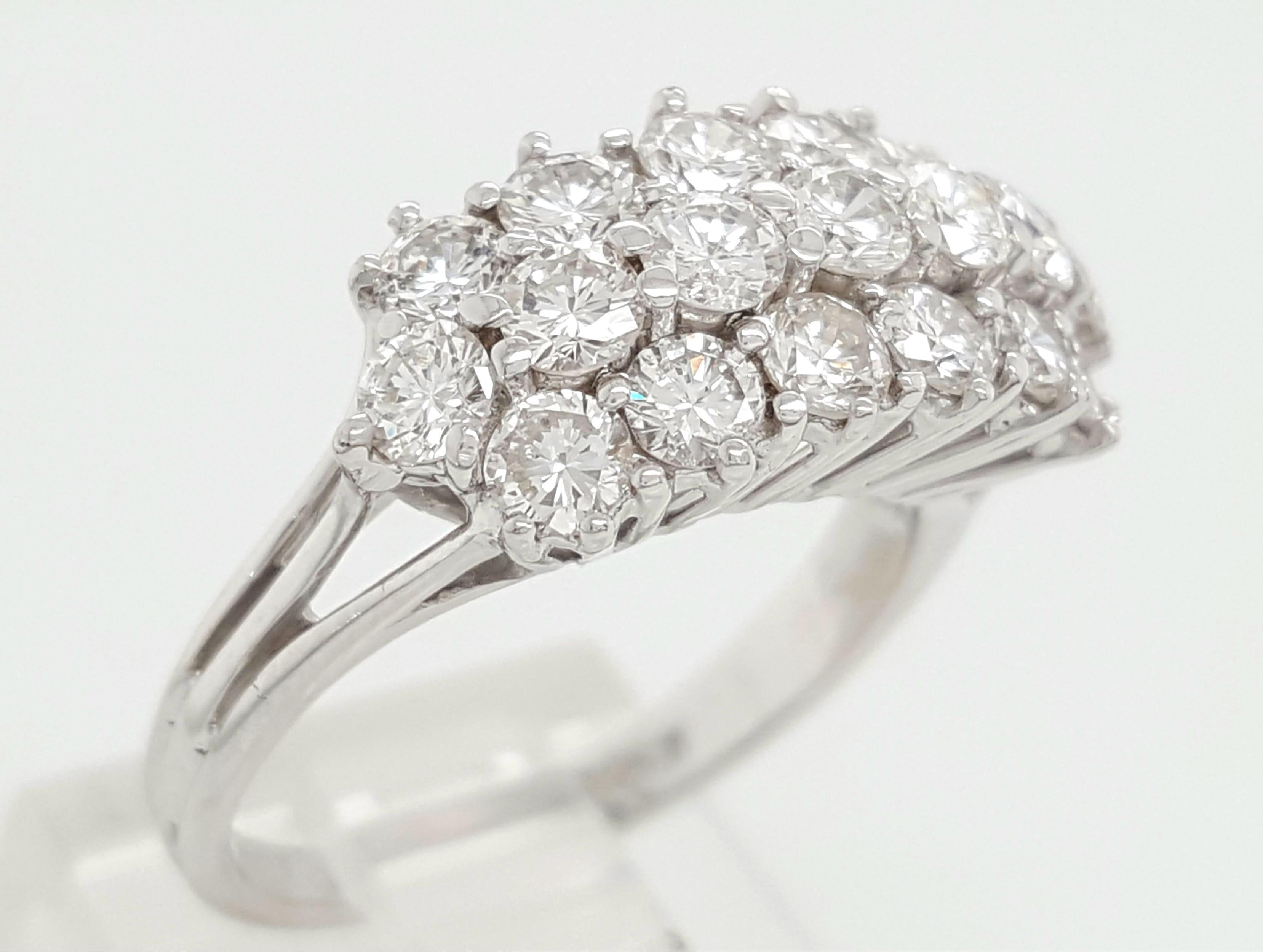 Here we have a genuine turn of the century Vintage Round Brilliant Cut diamond ring crafted in 18 karat white gold. The finishing on this ring is absolutely beautiful, the prongs hold the round cut diamonds perfectly displaying all the brilliance