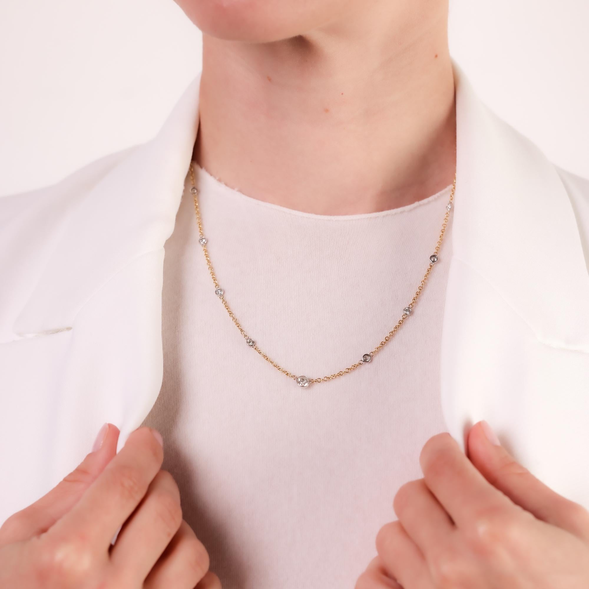 A refined vintage 1980s diamond necklace crafted in 18k yellow and white gold, featuring 17 sparkling diamonds totaling 1.70 carats for timeless elegance.

Center stone: 17 old European and round brilliant cut diamonds
Total diamond weight: