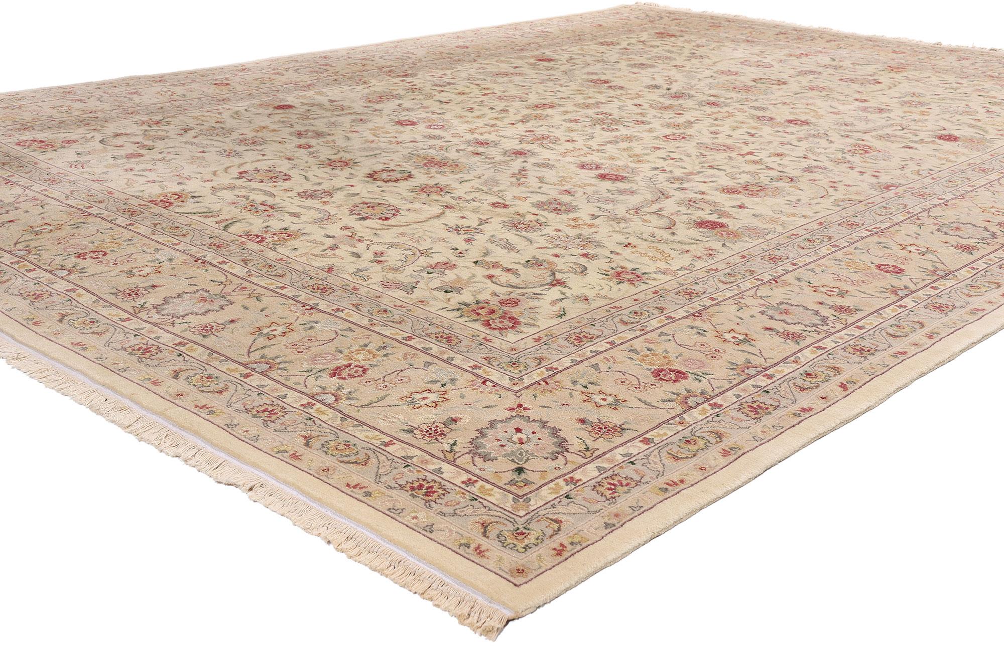 79246 Vintage Ivory Chinese Tabriz Rug, 08'11 x 12'04. Radiating quiet grandeur and timeless elegance, this hand-knotted wool and silk vintage Chinese Tabriz rug evokes the refined splendor of a bygone imperial court. With an ivory field as delicate