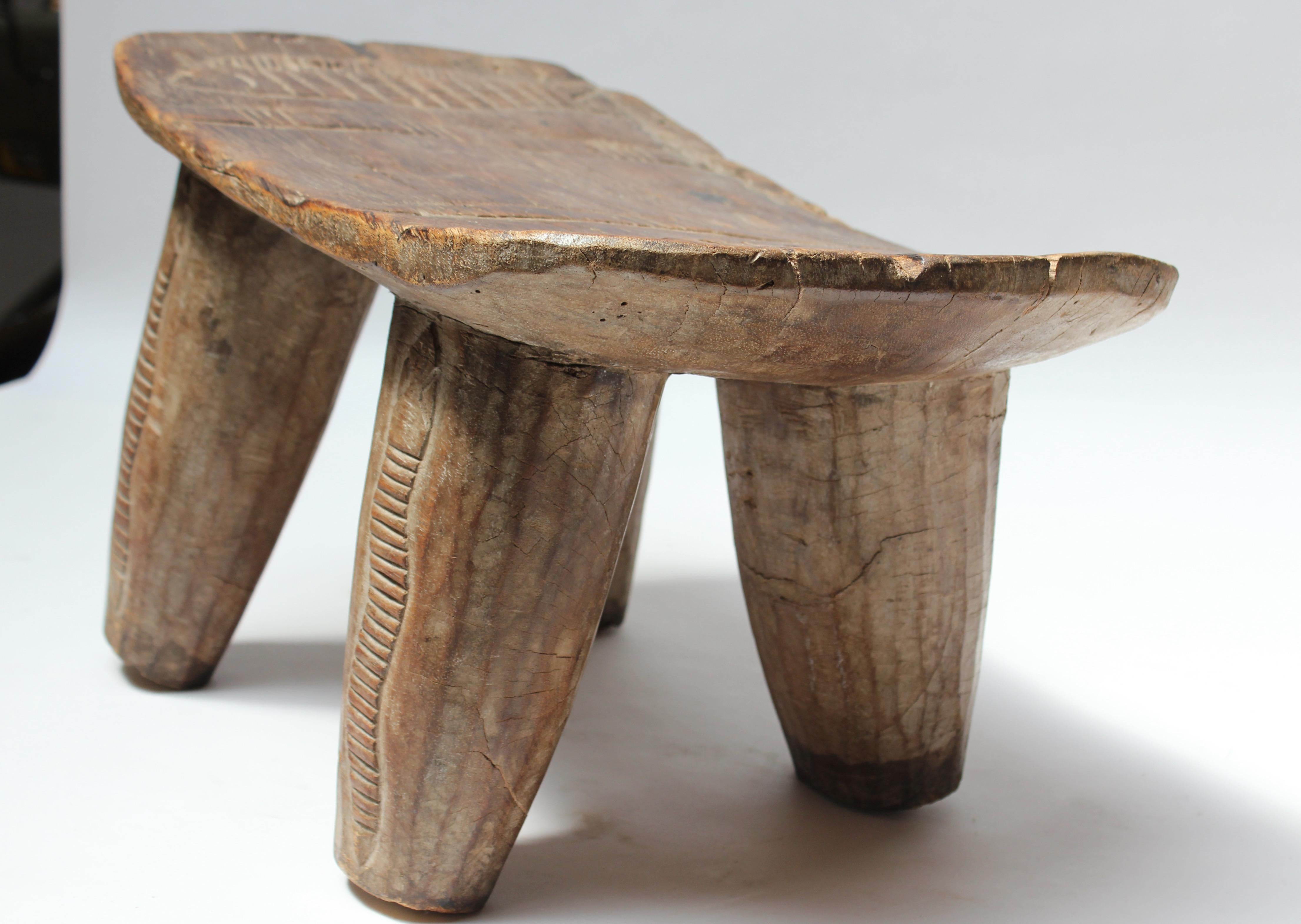 Vintage Ivory Coast Senufo Stool with Snake and Fish Motif  In Good Condition In Brooklyn, NY