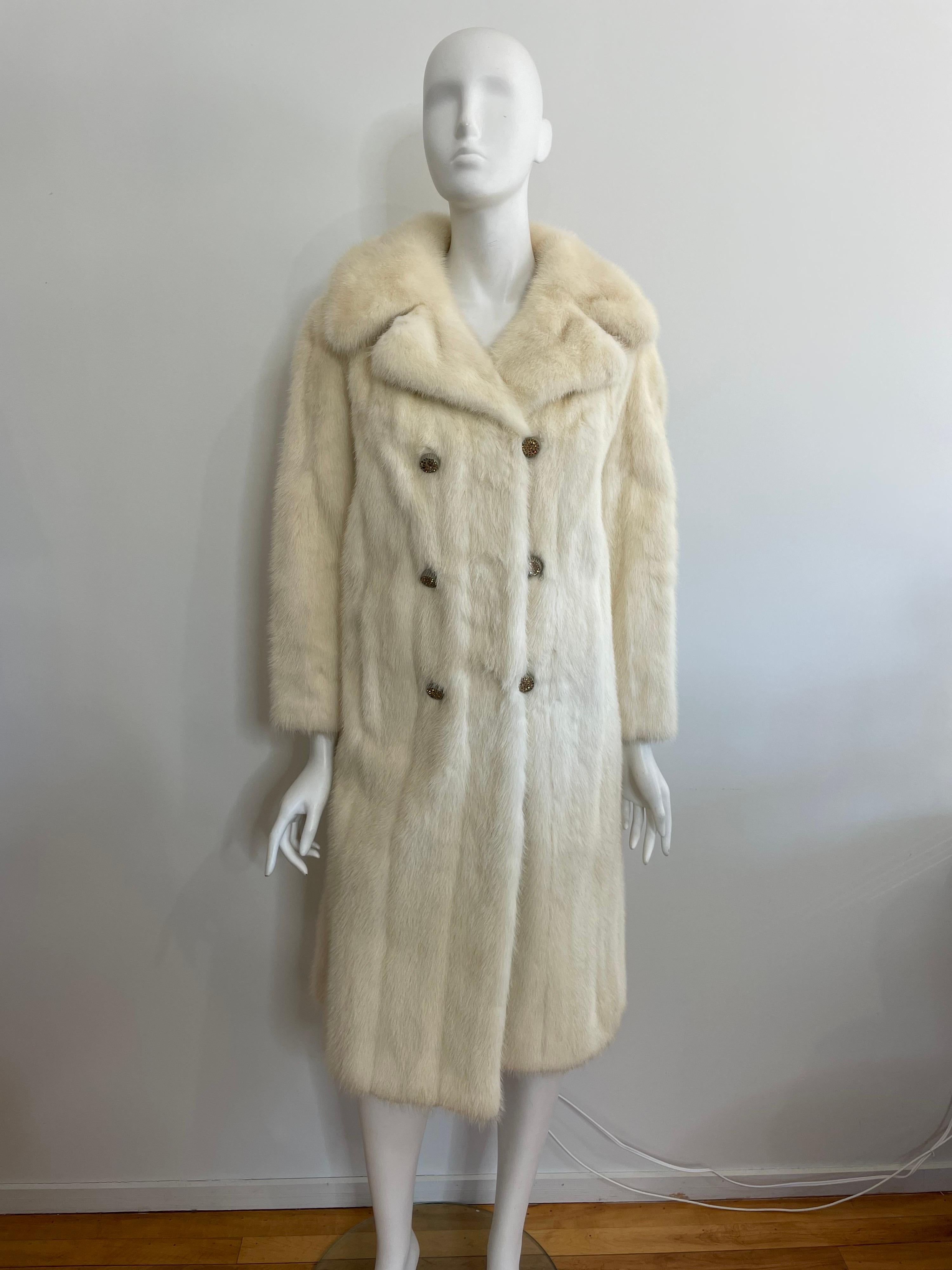 Soft and supple Ivory Mink. The buttons have some sparkle to them. A couple of buttons are missing a few stones. Classic Cut, timeless. 2 Slit side pockets. Please compare the measurements to something you own that fits you. Measurements * Up to 38