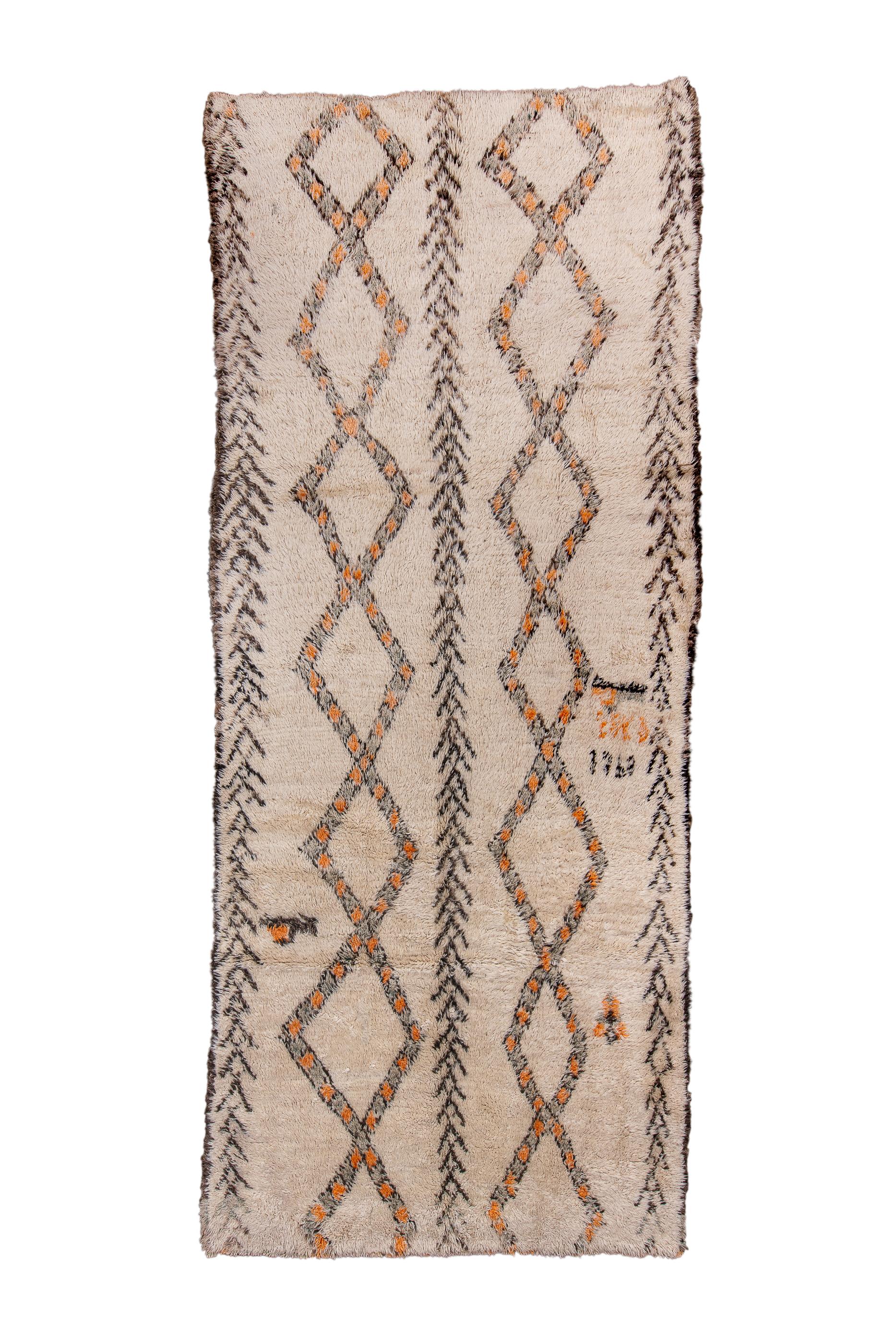 Looks like two similar runners joined along the sides, but actually it is an ivory ground kellegi (long rug) with two pole medallions of colourfully edged lozenges separated by a full length herringbone band. Similar bands at the sides. Ruffled