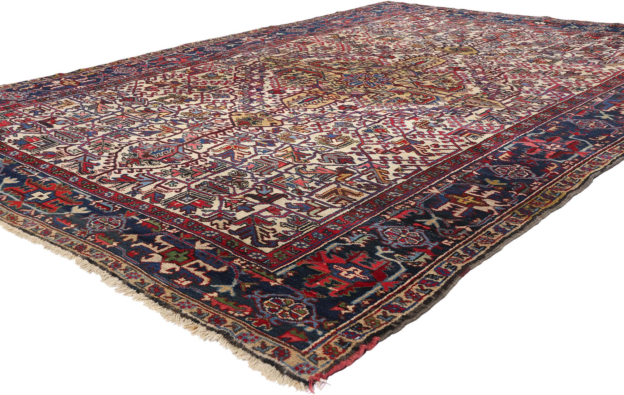 90011 Vintage Persian Heriz Rug, 07'08 x 10'09. Embrace the timeless elegance and sophisticated artistry of this hand-knotted wool vintage Persian Heriz rug, a magnificent piece that exudes charm and cultural richness. The composition features a