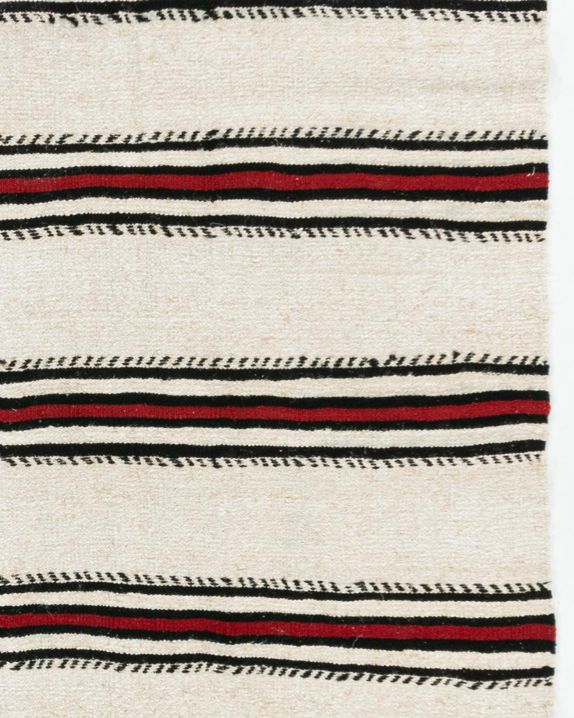 Vintage Ivory Turkish Kilim Area Rug 4'8 X 8'4. This vintage Turkish flat weave Kilim was hand-woven in the 1940's. The simplicity and boldness of this piece can also give a contemporary feel and is able to look at home in both a modern and