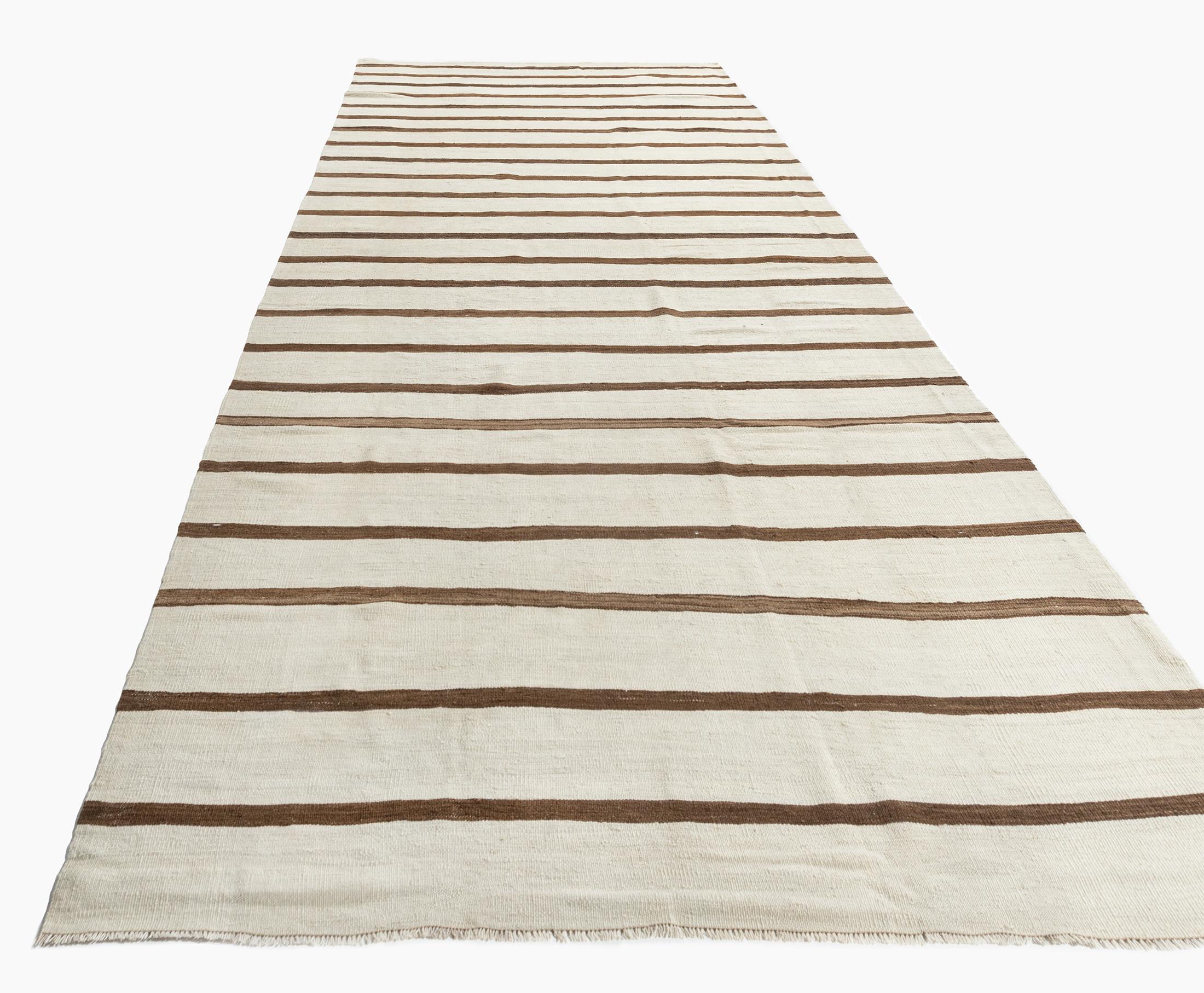 Vintage Ivory Turkish Kilim Runner 4'11 X 13'8. This vintage Turkish flat weave Kilim was hand-woven in the 1940's. The simplicity and boldness of this piece can also give a contemporary feel and is able to look at home in both a modern and