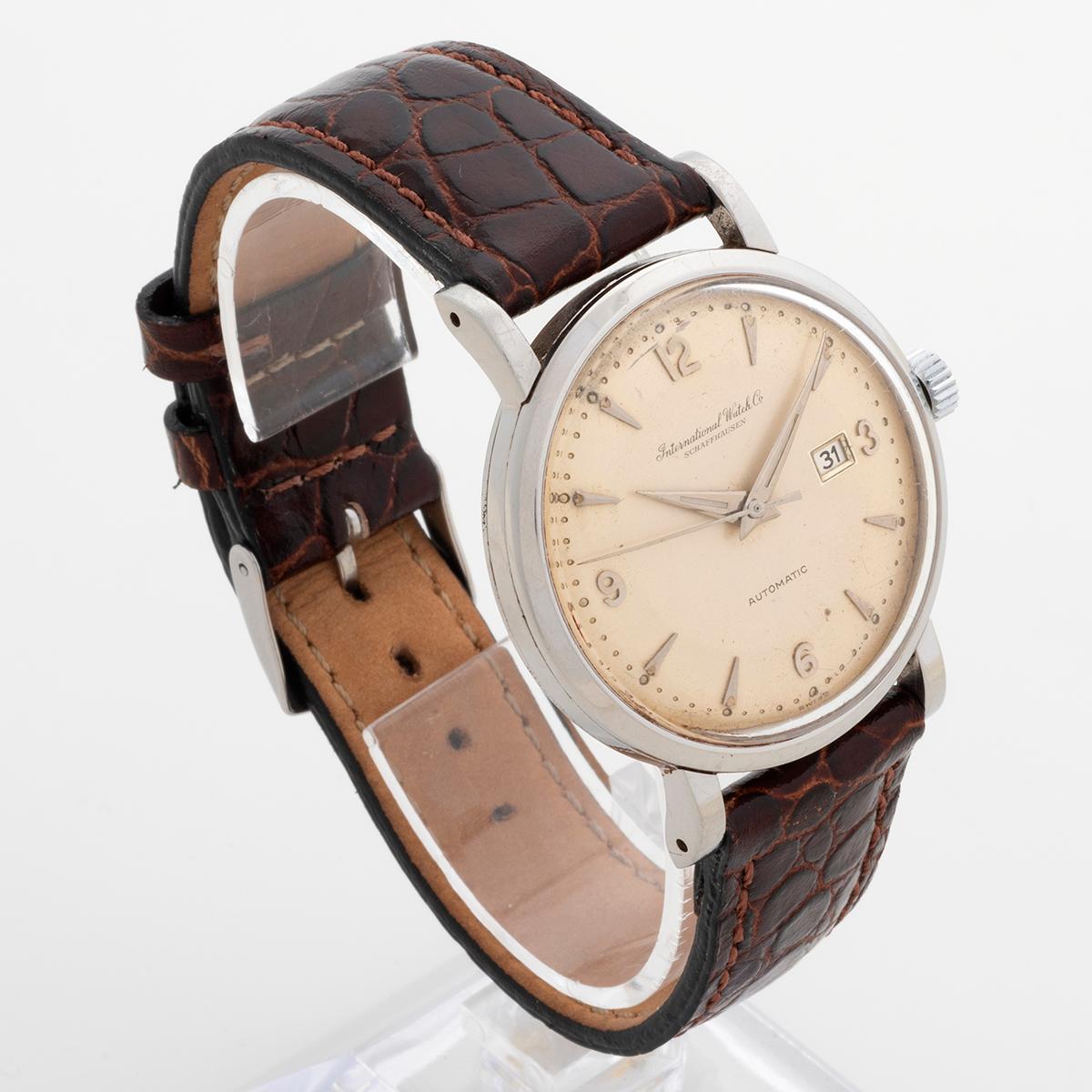Our vintage IWC automatic features a large stainless steel case of 35mm and has a date function and is powered by a 21 jewel movement. Of note is the attractive lightly patinated dial. A new leather strap and tang buckle are fitted and a IWC Service