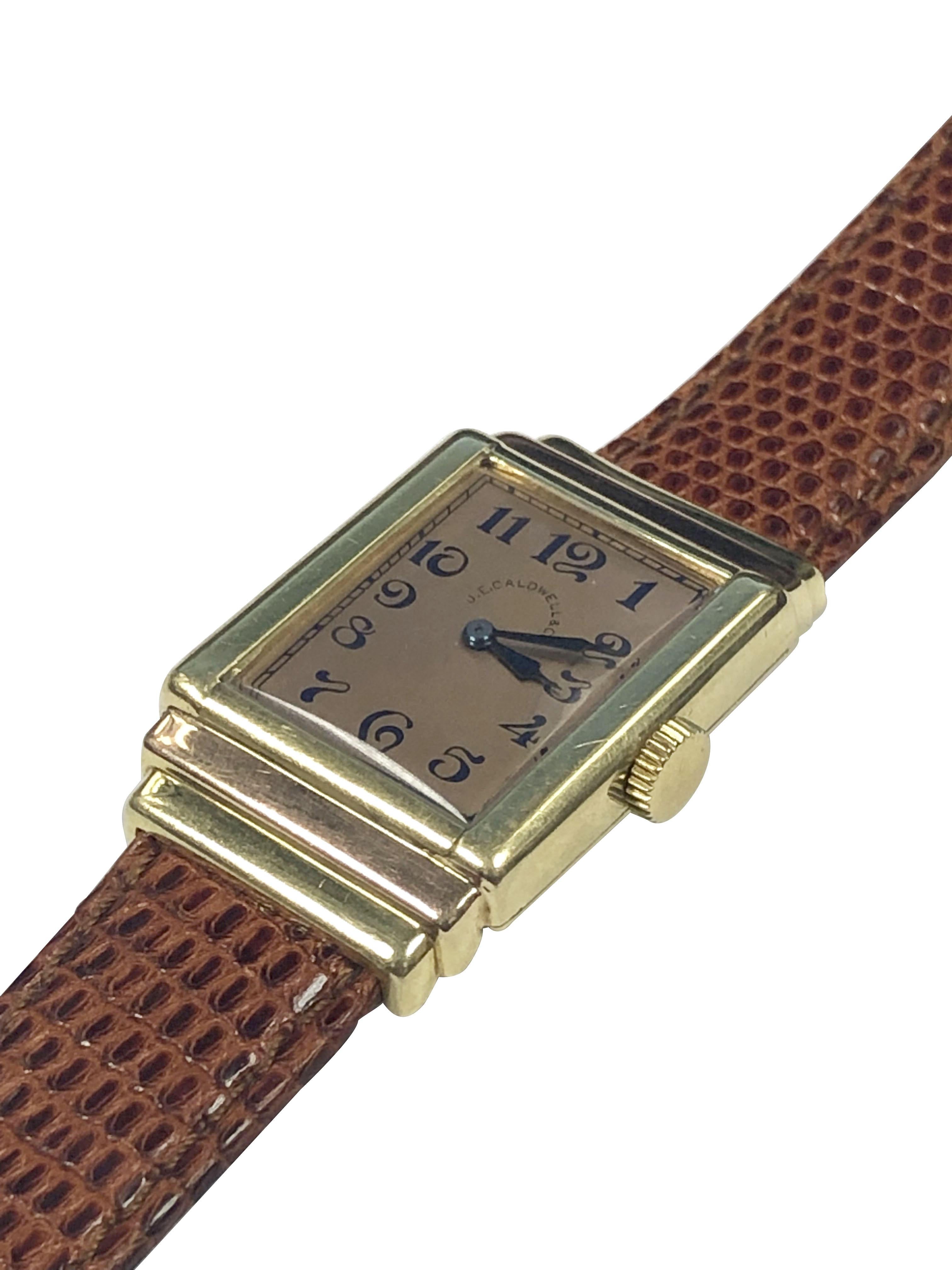 Circa 1930s I.W.C. International Watch Company, wrist watch retailed by J.E. Caldwell. 39 X 25 M.M. 2 Piece 18k Green and Rose Gold stepped case by Cress Arrow case makers. 17 Jewel Mechanical, Manual wind movement, original Rose Satin dial with