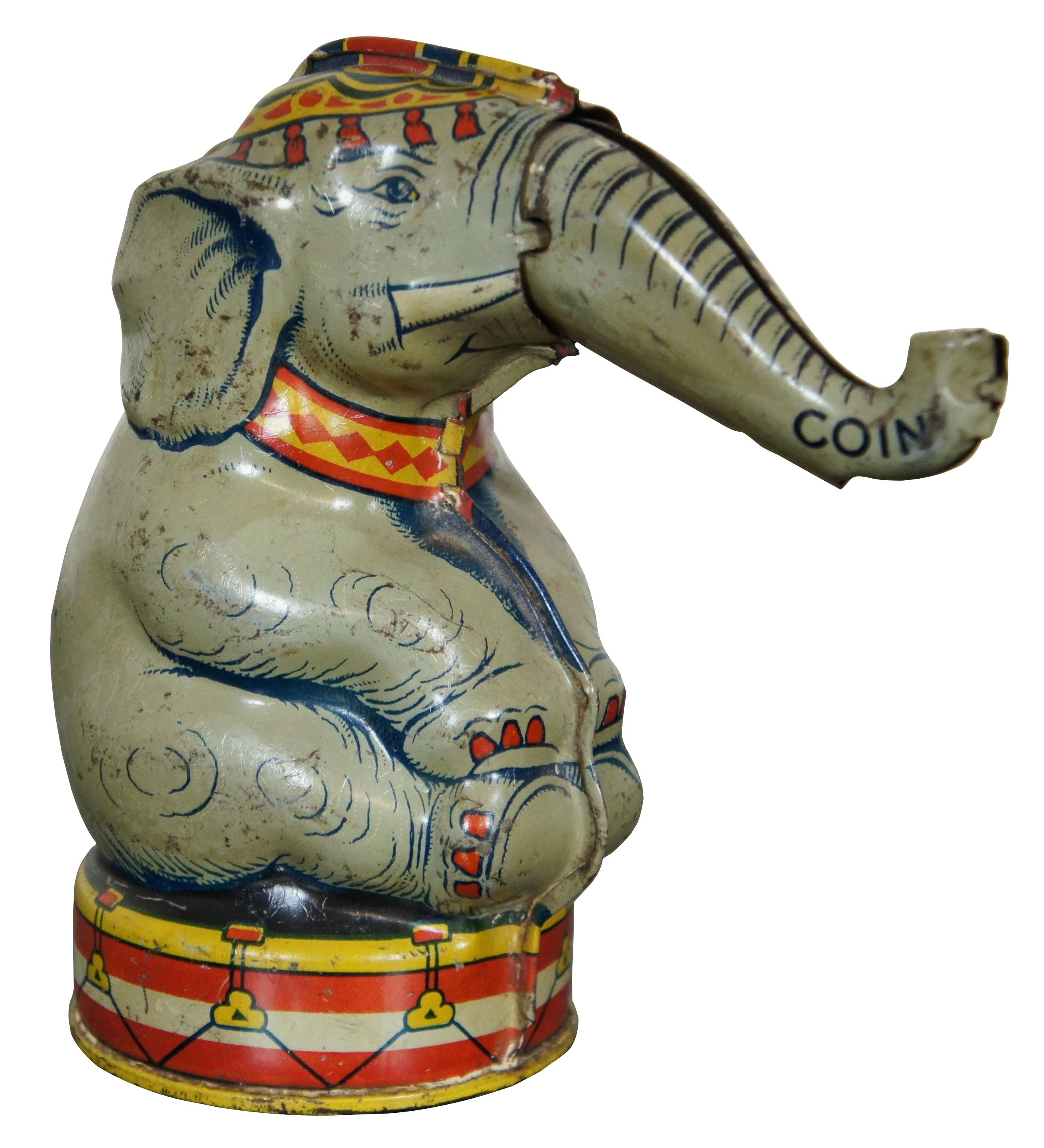 Vintage mid century tin litho mechanical coin bank in the shape of a circus elephant, mad by J. Chein & Company.