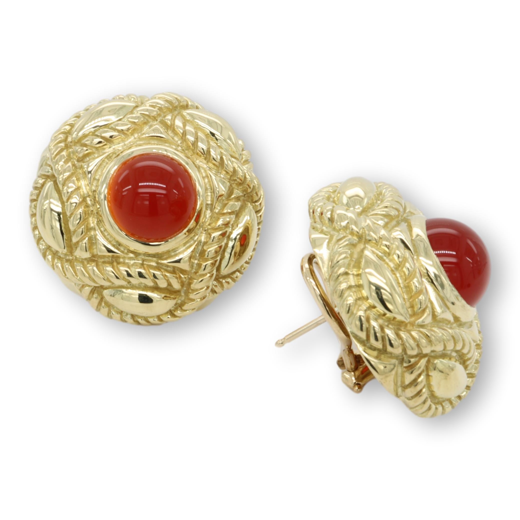 Pair of Vintage J.J. Marco earrings finely crafted in 18 karat yellow gold with 2 cabochon red cornelian centers measuring 9 mm x 9 mm inside a twisted rope design circle earring with large omega backs and posts. Earring measures 25 mm. Fully