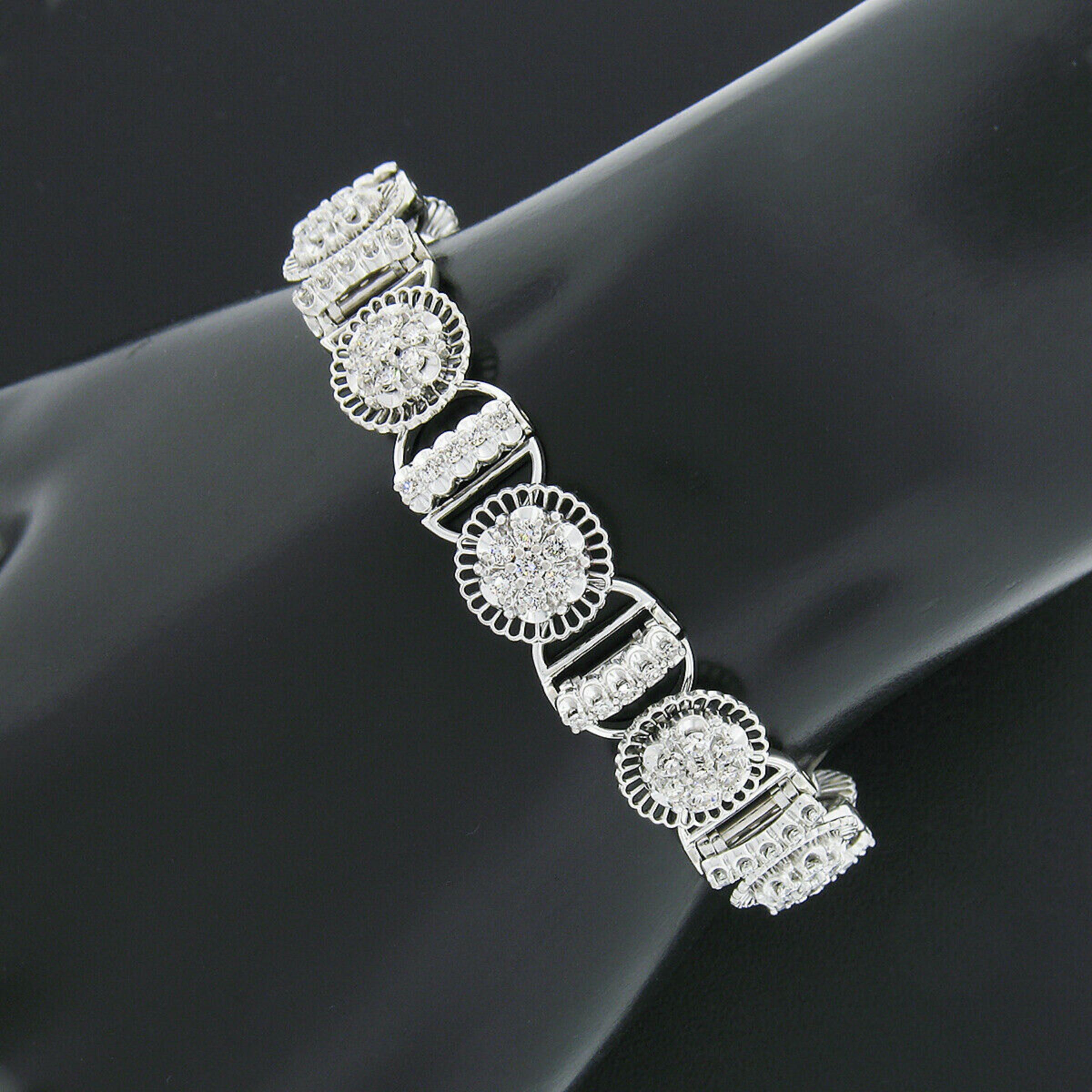 Here we have a vintage Jabel tennis bracelet that was crafted from solid 18k white gold and features fine diamonds set throughout each individual link. The bracelet carries 120 single cut diamonds which are neatly set in flower clusters and also