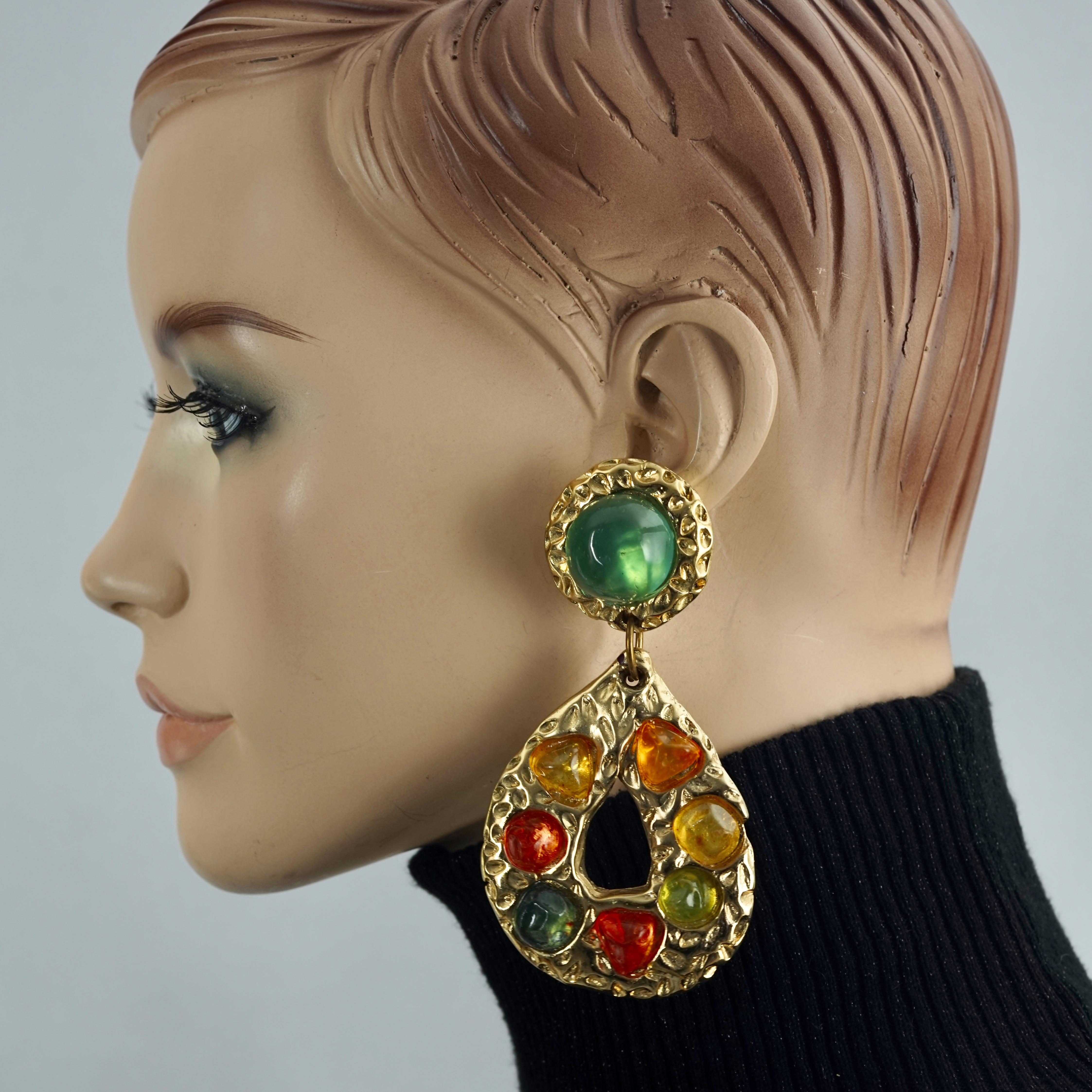 Vintage JACKY DE G Baroque Multicolor Cabochon Massive Earrings

Measurements:
Height: 3.93 inches (10 cm)
Width: 2.04 inches (5.2 cm)
Weight per Earring: 30 grams

Features:
- 100% Authentic JACKY DE G.
- Baroque style earrings.
- Massive