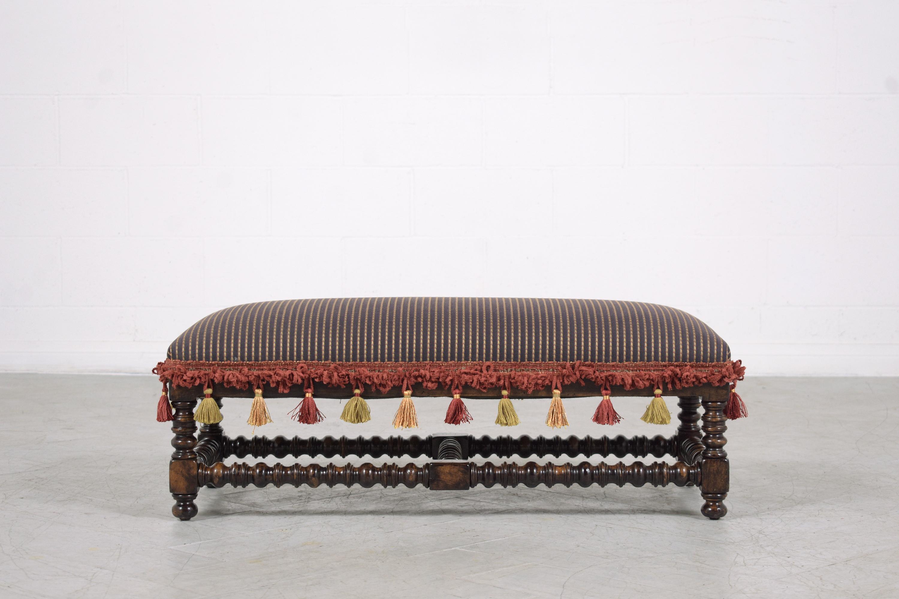 This vintage jacobian style bench is in great condition and has been newly restored and reupholstered by our professional craftsmen team. This bench is eye-catching twists stretched pedestal legs stained in a dark walnut color with semi-gloss