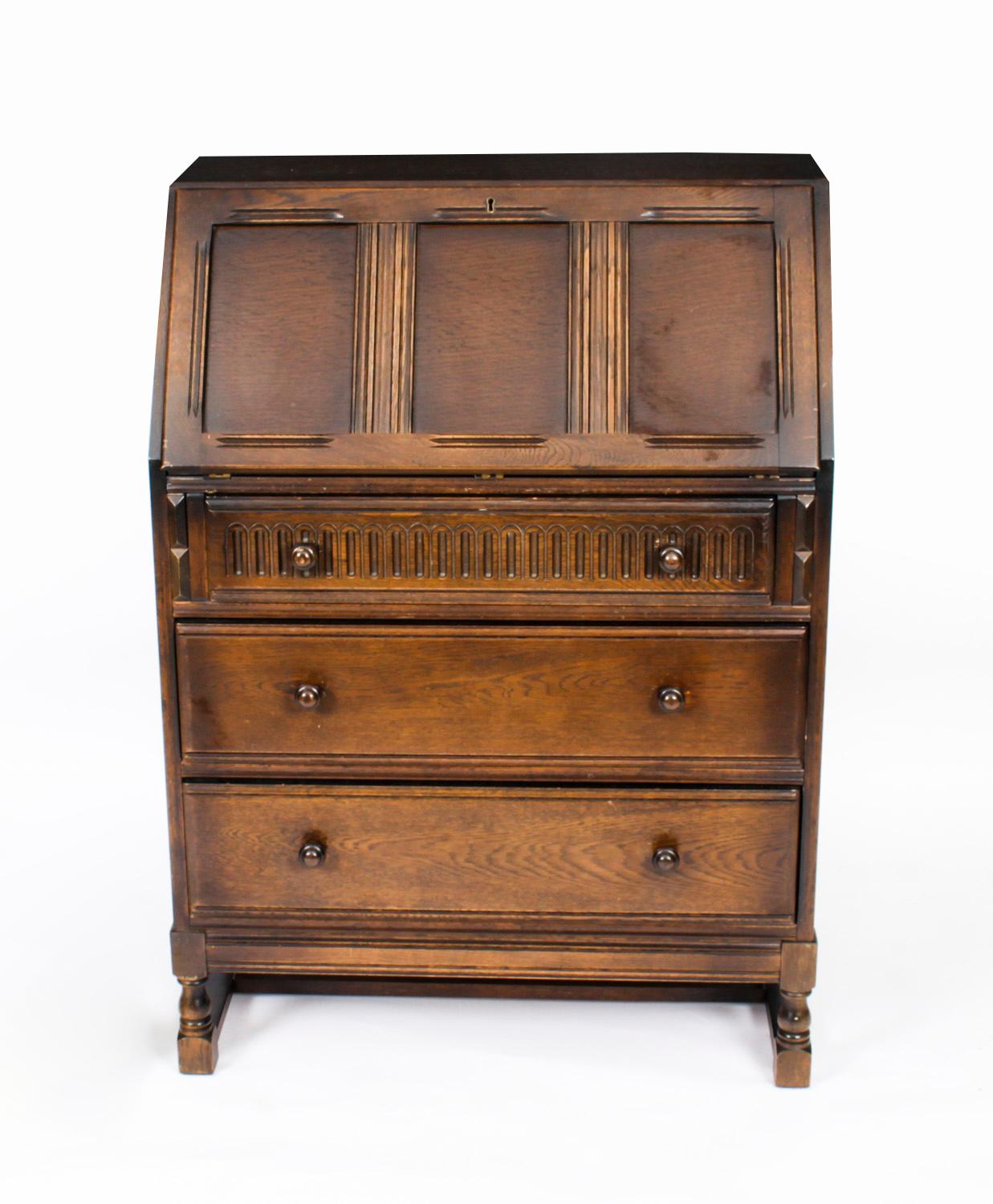 A delightful Jacobean Revival oak bureau, mid 20th century in date.

Condition:
In good condition. As a vintage item, the bureau show signs of use commensurate with age

Dimensions in cm:
Height 108 x width 76 x depth 41

Dimensions in