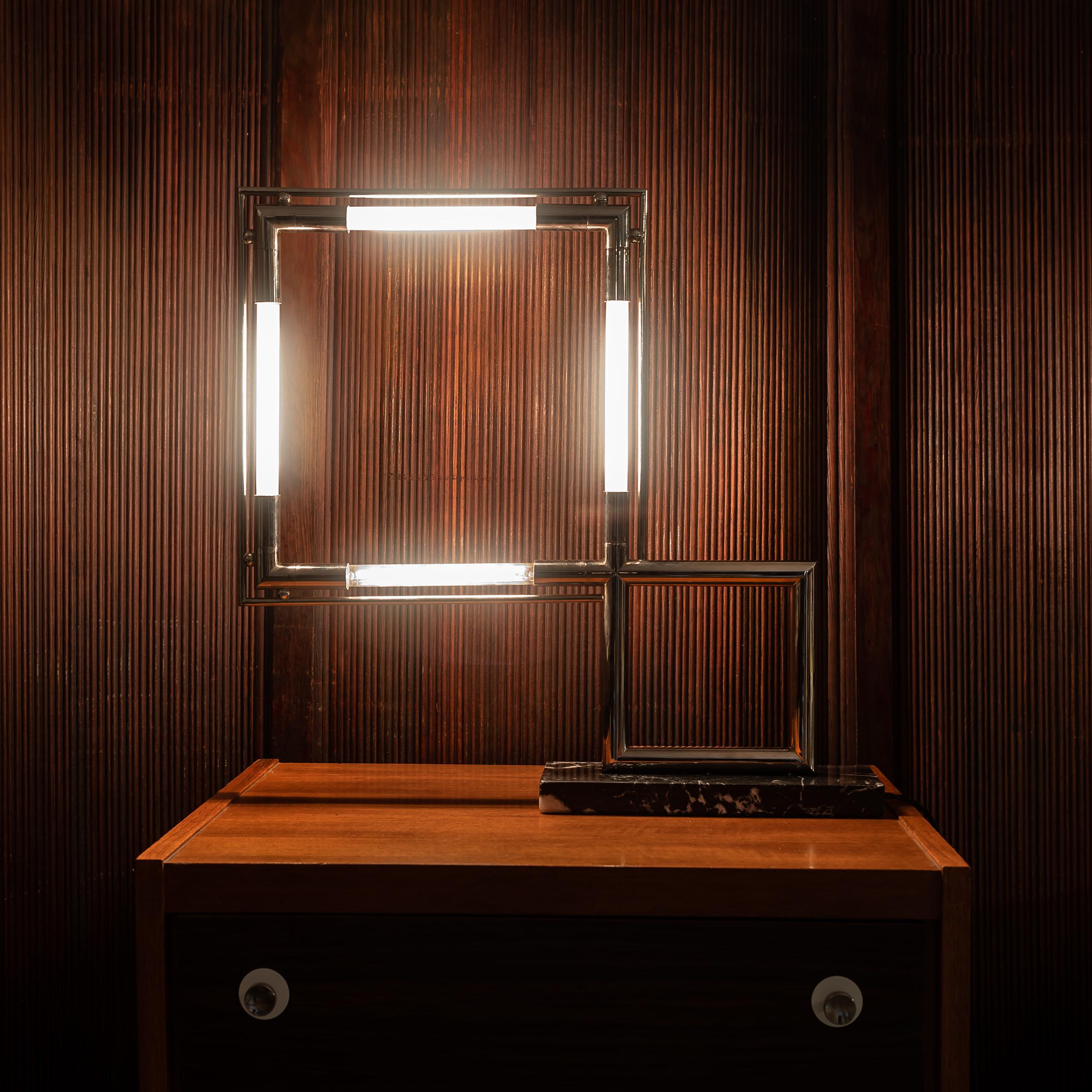 The Vintage Jacques Adnet Quadro Table Lamp is more than just a lighting fixture—it’s a statement of timeless elegance and masterful craftsmanship. Designed by the renowned French modernist Jacques Adnet, this lamp embodies the perfect blend of Art