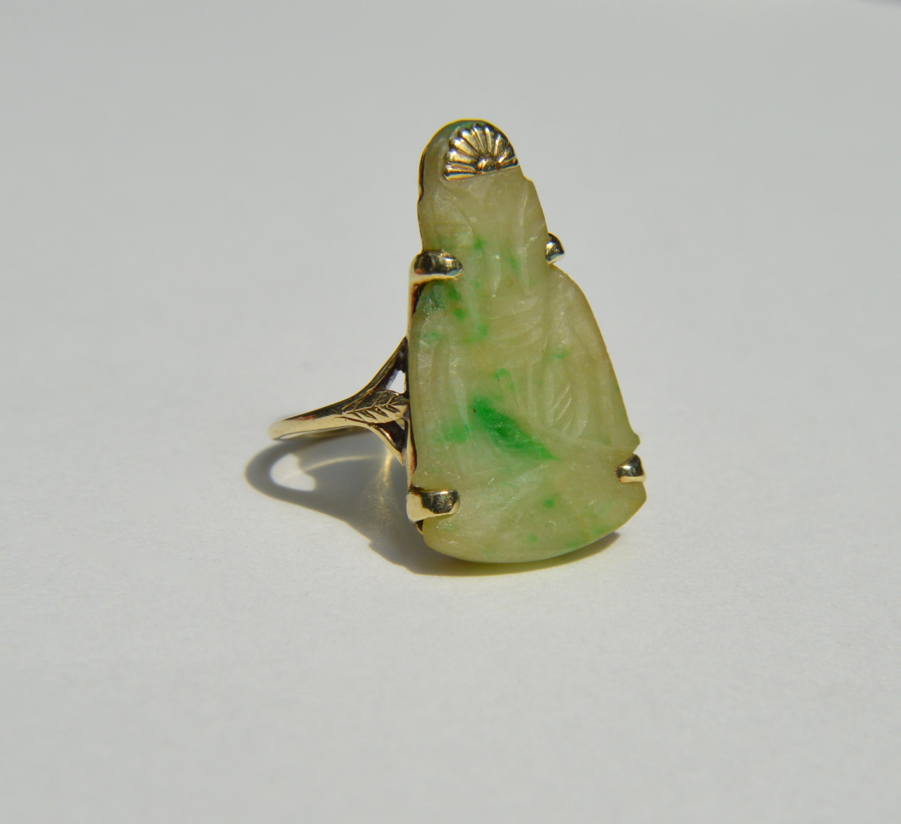 Beautiful vintage c1970s 10K yellow gold jadeite jade large Buddha ring. Size 6.5, can be resized by a jeweler. Ring is unmarked, but tested as solid 10K gold. In excellent condition. Ring weighs 5.84 grams. 

Jade is a symbol of serenity and