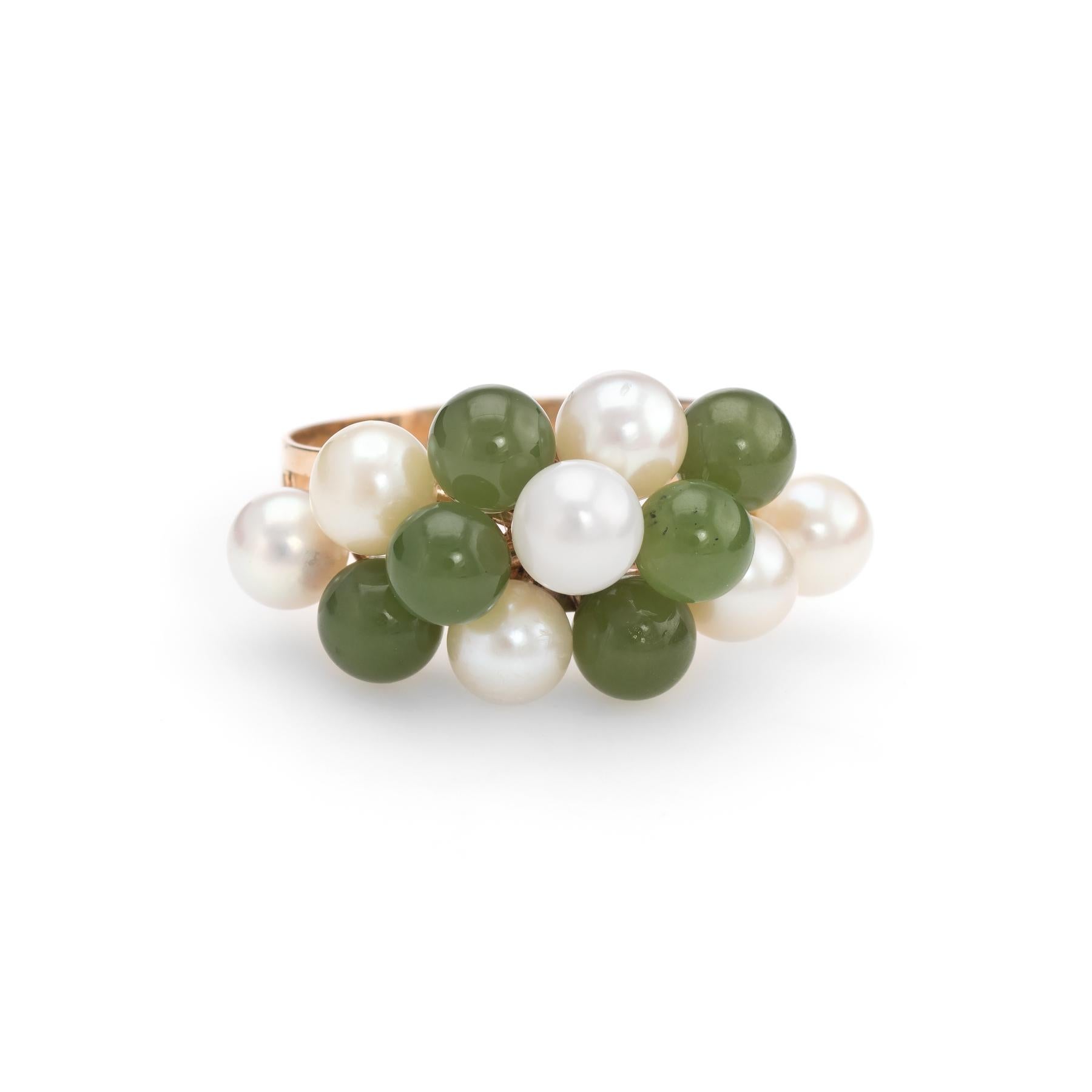 Elegant vintage ring (circa 1950s to 1960s), crafted in 14 karat yellow gold. 

7 cultured pearls range in size from 4mm to 5mm. The 6 pieces of jade (nephrite) measure 4.5mm each. The pearls & jade are in excellent condition and free of cracks or