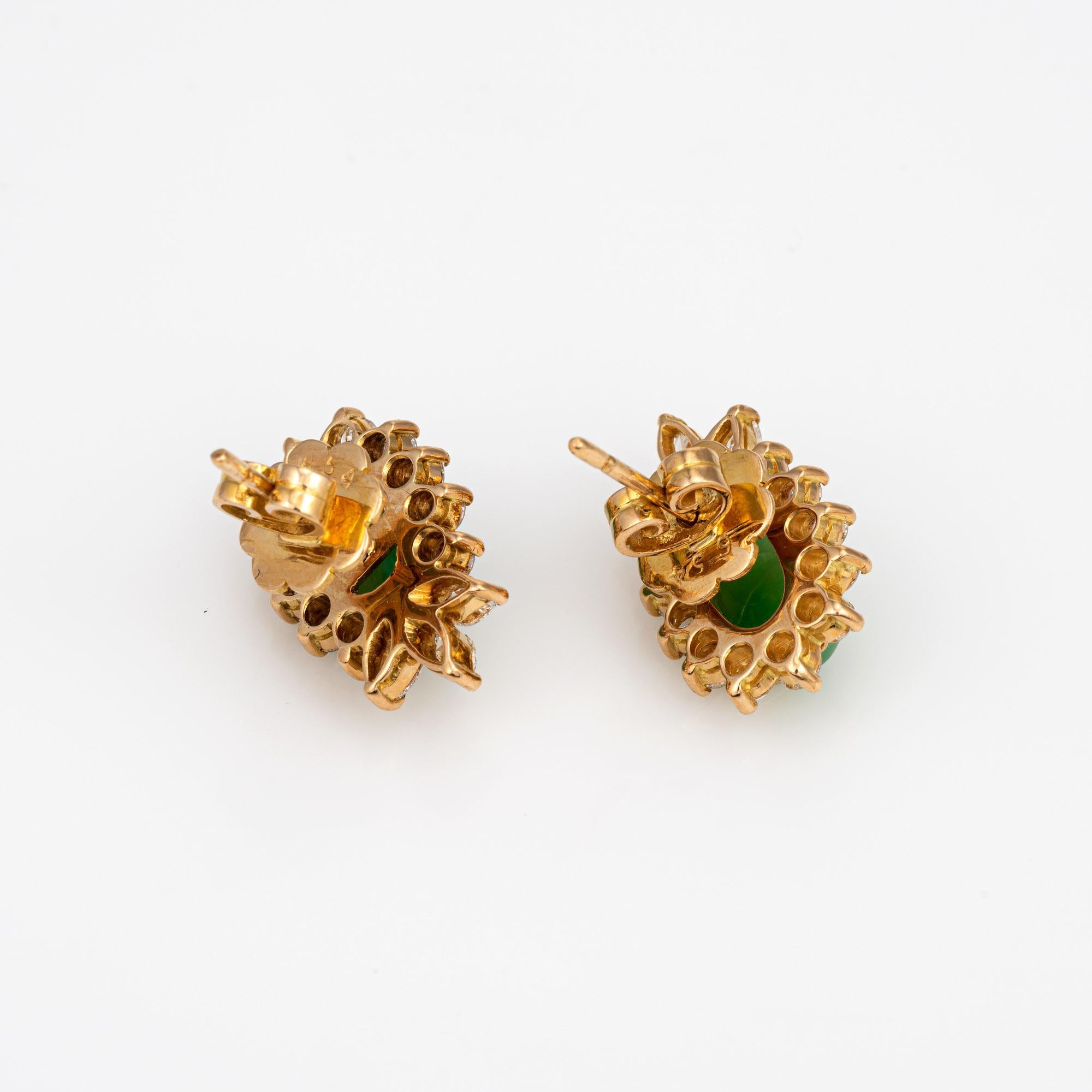 Stylish jade & diamond earrings crafted in 14k yellow gold.

Round brilliant and marquise cut diamonds total an estimated 2 carats (estimated at H-I color and VS2-SI2 clarity). The jade measures 10mm x 6mm. The jade is in very good condition and