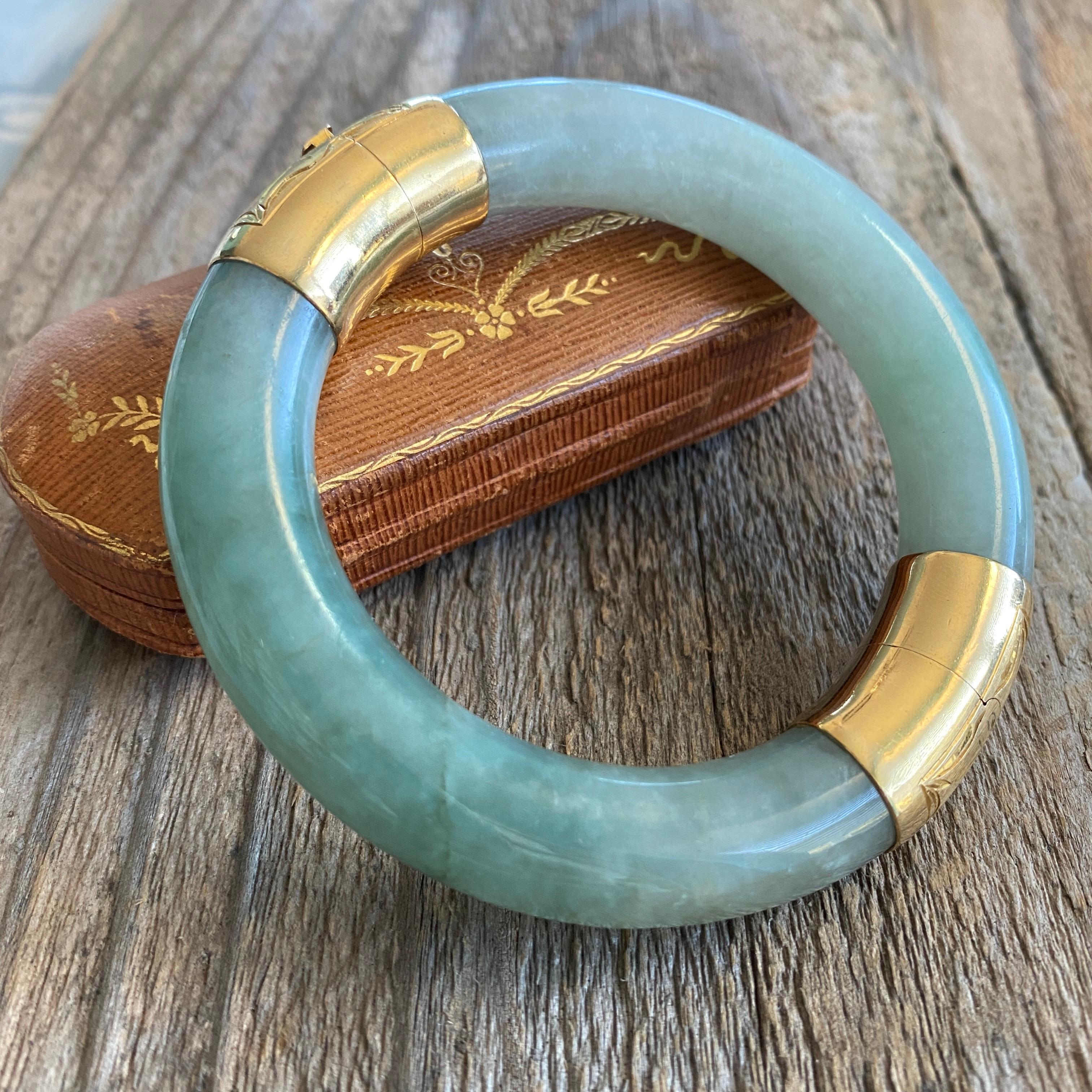 Details:
Fabulous heavy vintage green Jade Jadeite bangle bracelet with a 14K gold clasp and hinge. Mid century green jade with beautiful marbling, bangle bracelet, and it has a nice solid clasp with a safety chain. The bracelet is stamped 585 on
