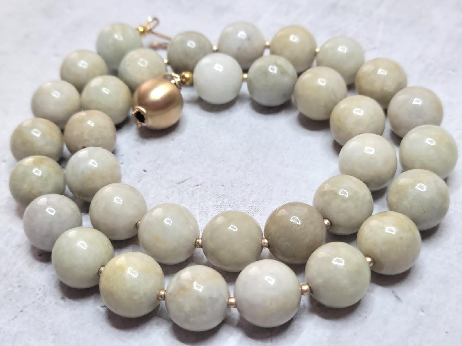 The jade beads on this necklace are undyed, untreated natural creamy honey tan jades of excellent quality. The jade beads are old. Each bead is cut and polished by hand. Presumably, the jade beads belong to the period of the Qing Dynasty (1644 -