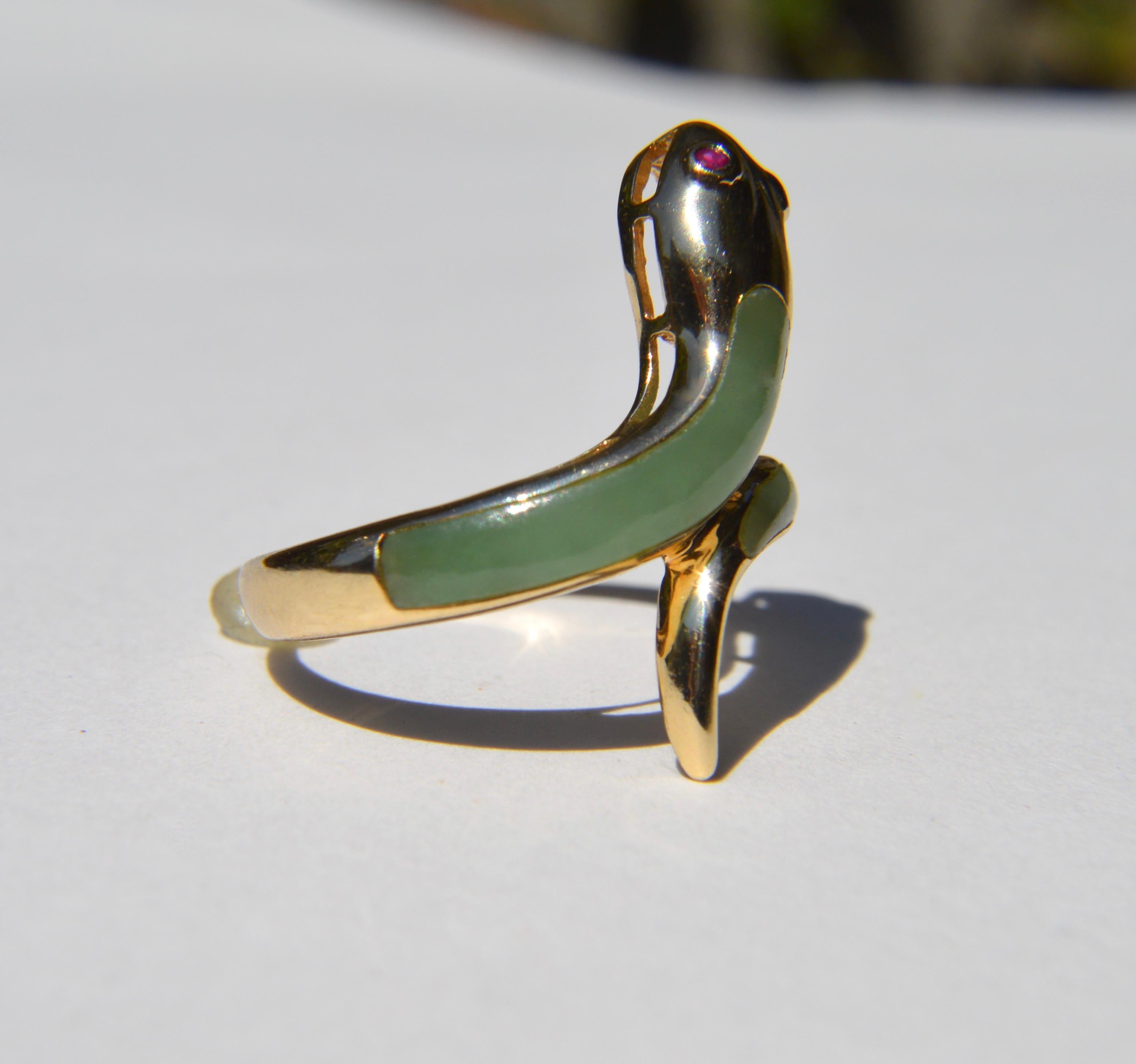 Gorgeous vintage circa 1970s 10K yellow gold natural jade and ruby snake ring. Size 7. In very good condition. Marked as 10K. 

All items arrive in a black with gold logo gift box.