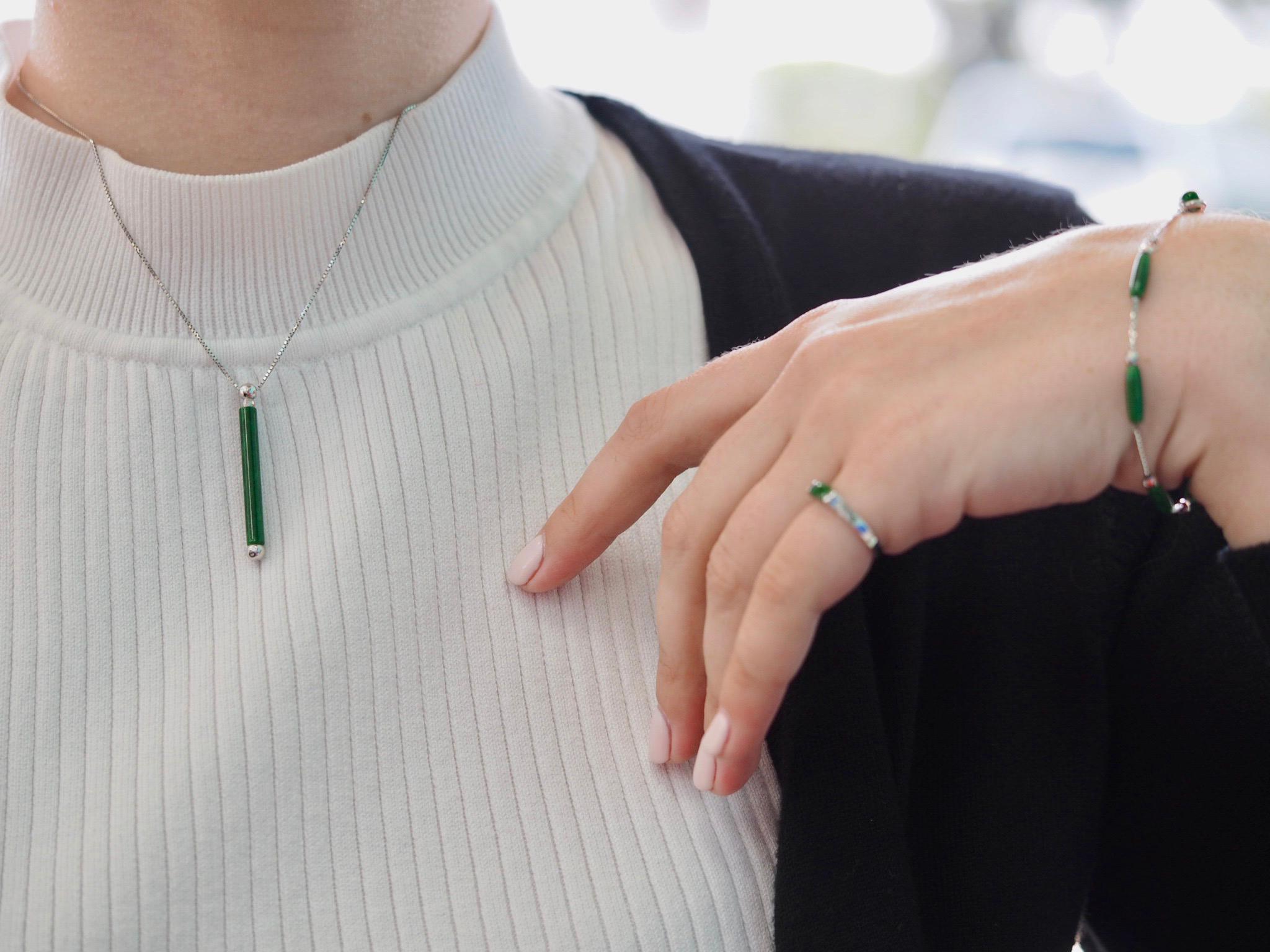 This Vintage jadeite pairs well with any style! Its deep green is truly mesmerizing.

The Necklace has a cylinder jadeite pendant that measures 30.90 x 2.9 mm. 15.75 inch chain. 3.8 Grams.

The Bracelet includes six cylinder jadeites that measure