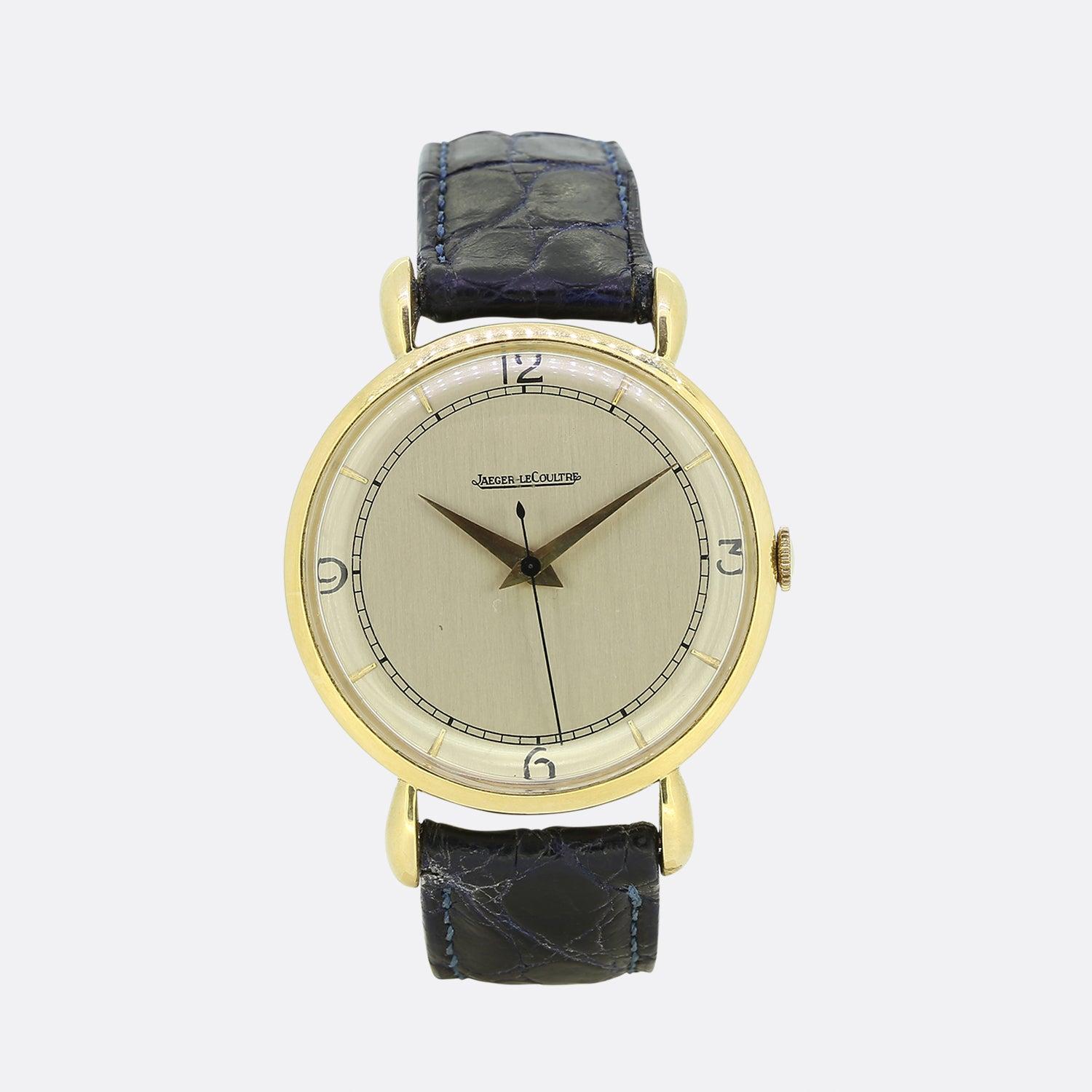 This is a delightful vintage Jaeger-Le Coultre wristwatch from the 1950s. This piece features a circular face with a cream coloured dial, gold hour markers and gold hands. Yet its most notable characteristics include its fancy teardrop lugs and