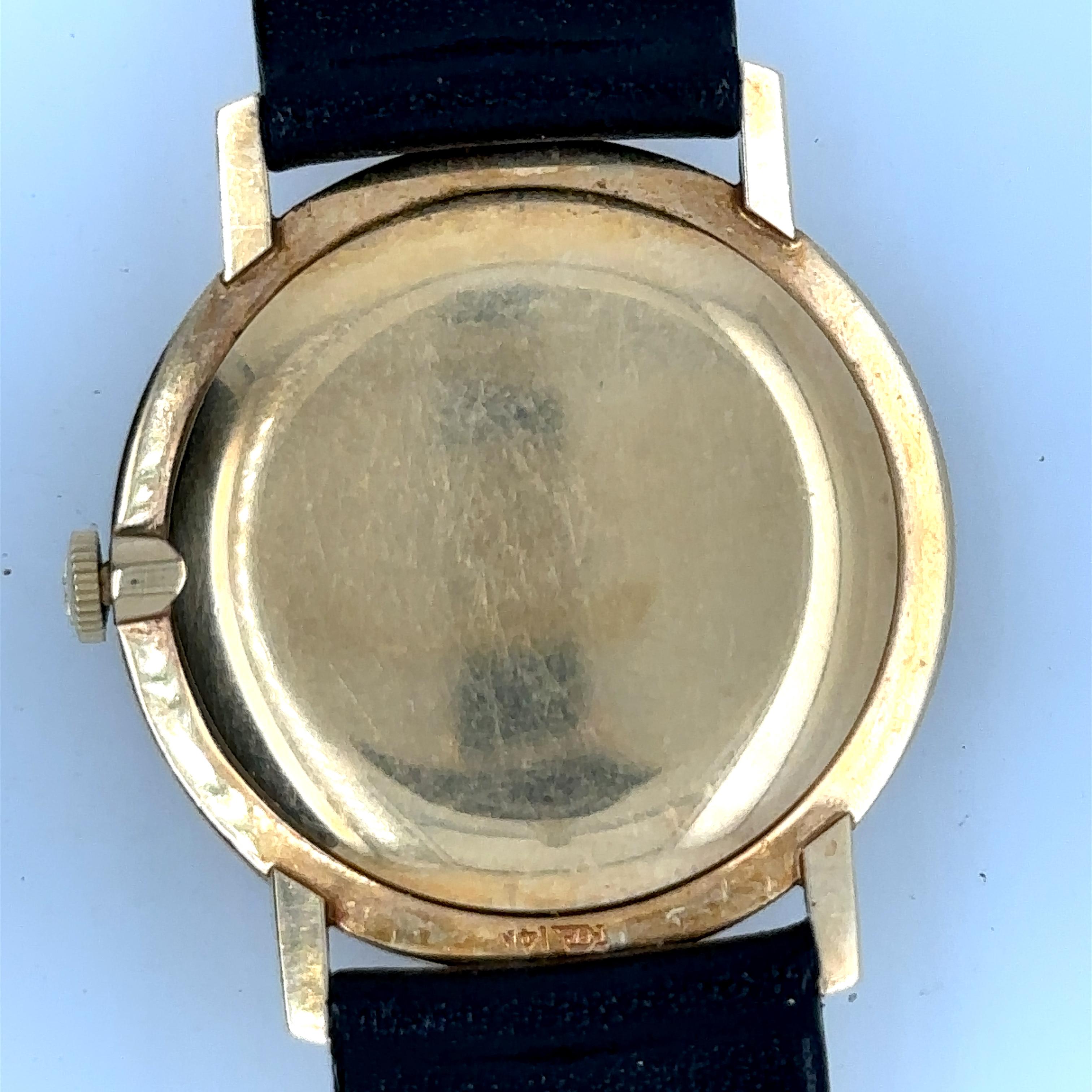 Vintage Jaeger Lecoultre 17J Dia Dial Solid 14K Gold Watch.
14k yellow gold case, bezel and caseback.
Champagne coloured dial with a black oval that has 10 diamond numeral markers.
Has roman numerals at 12 and 6 o'clock position.
Strap has been