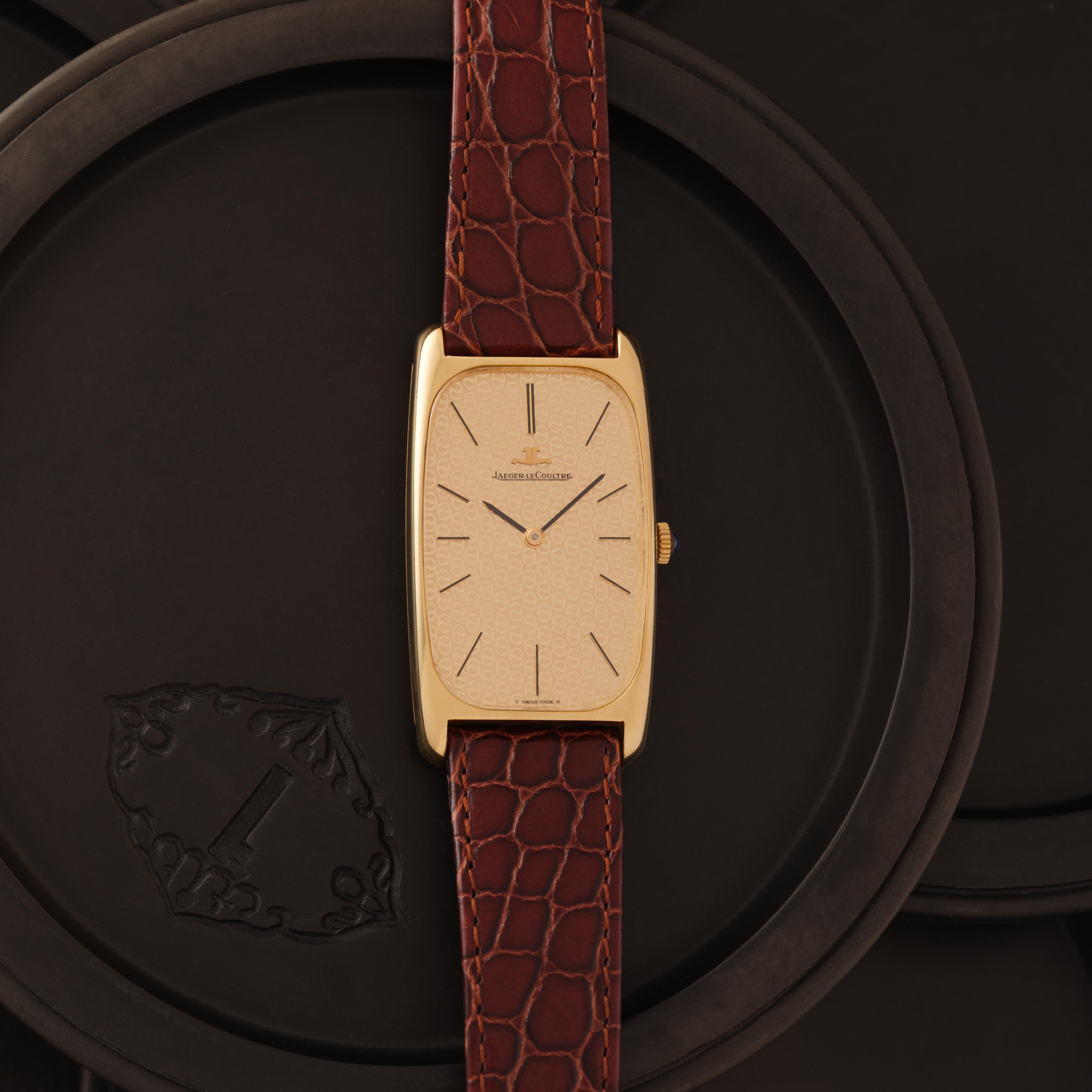 Vintage Jaeger LeCoultre Model 9107.21 18k Yellow Gold 24.5mm x44.5mm Gold Dial, Manual Wind, 17 Jewels, Made in Switzerland c.1970s

Maker: Jaeger LeCoultre
Model: Tank 9107.21
Year: 1970s
Material: 18k Yellow Gold
Dial: Gold
Case Measurement: