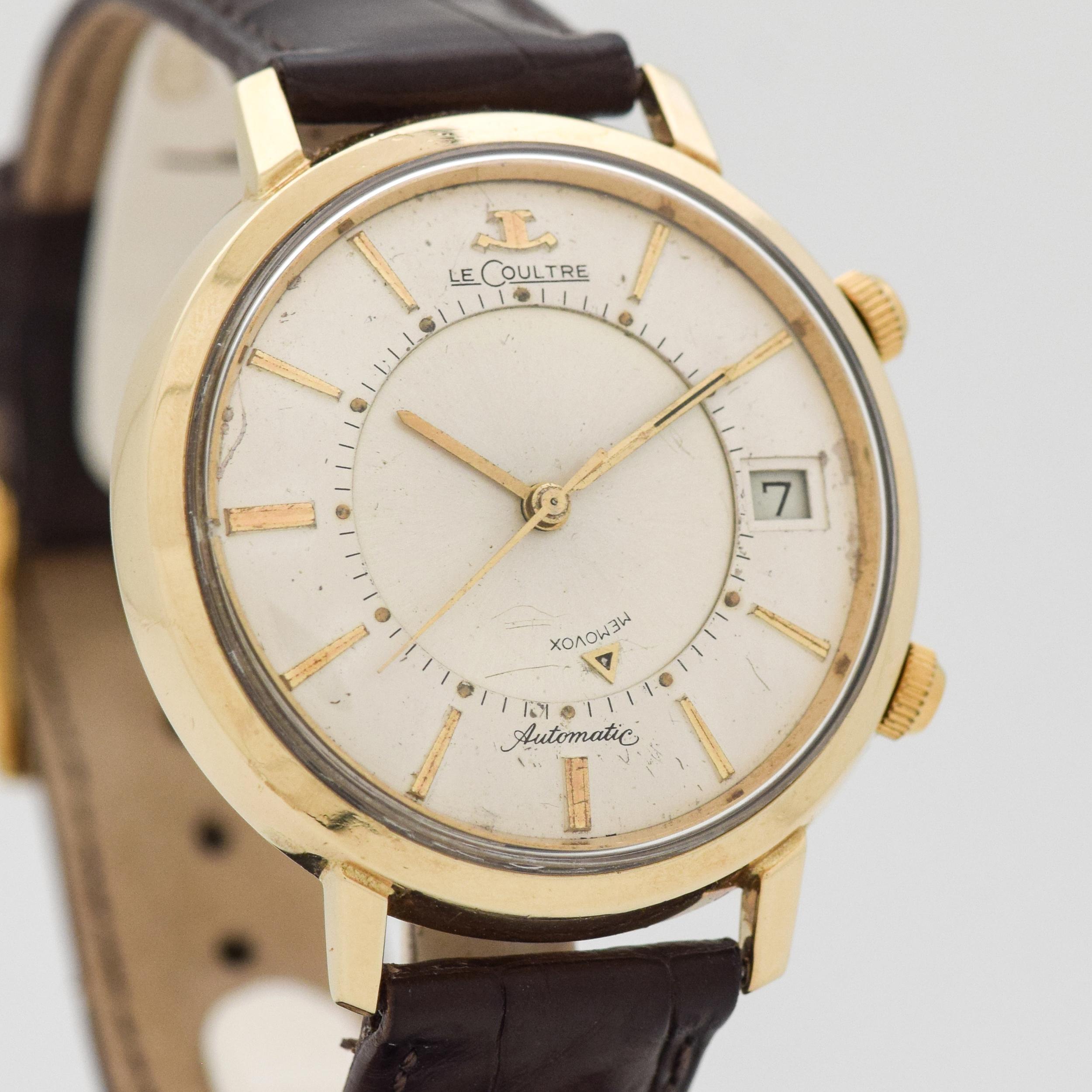 1950's Vintage Jaeger - Le Coultre Memovox Alarm Automatic with RARE Date Feature 10k Yellow Gold Filled watch with Large 38 mm Case and Original Silver Dial with Applied Gold Color Stick/Bar/Baton Markers Markers. 38mm x 44mm lug to lug (1.5 in. x