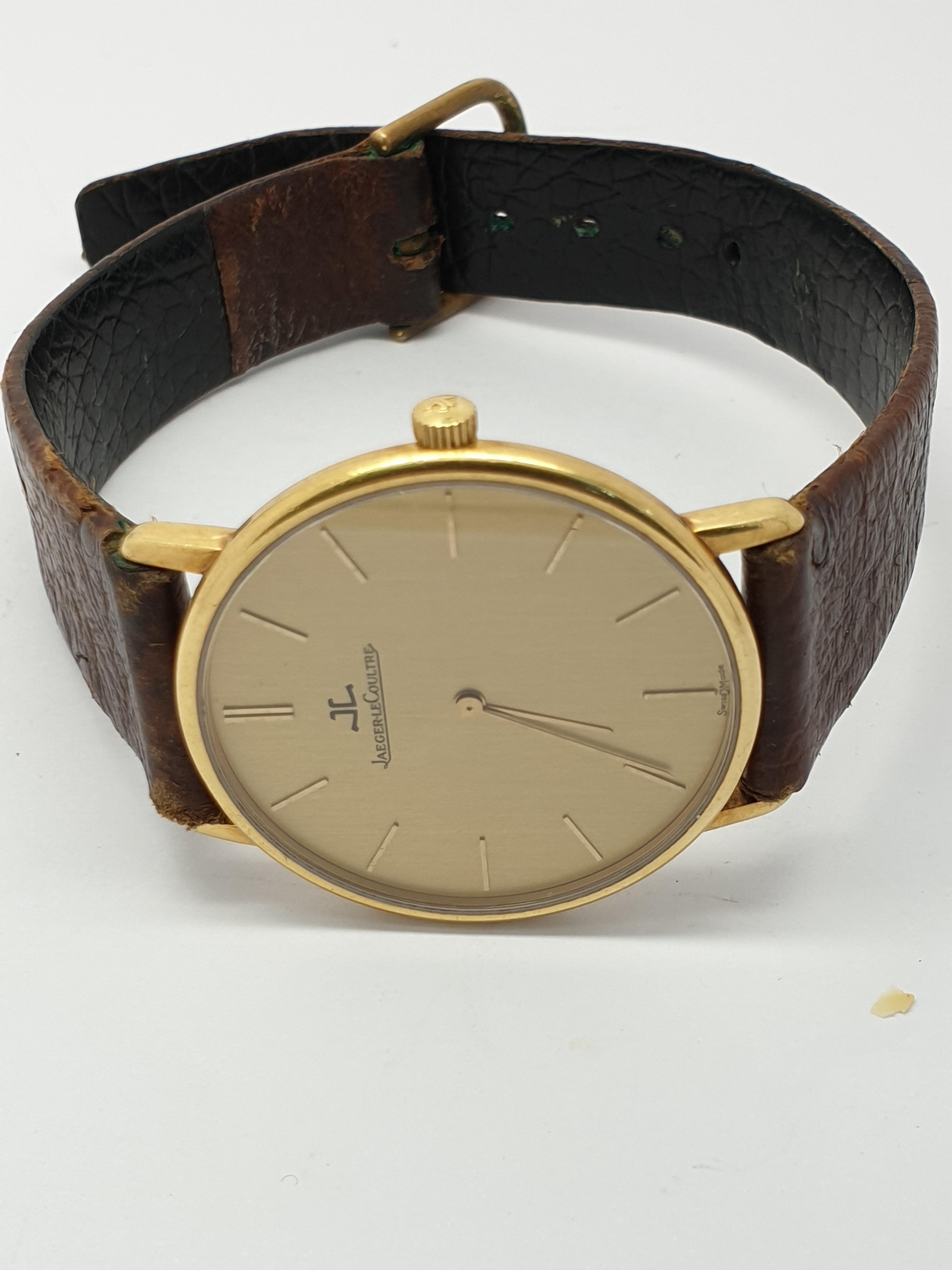 Vintage 18 kt yellow  gold Jaeger LeCoultre  watch on leather strap. The model equipped with JLC quartz  movement which is in good working order.  As a vintage piece has mineral glass . Case is 18 kt  yellow gold. The timepiece  diameter is 35