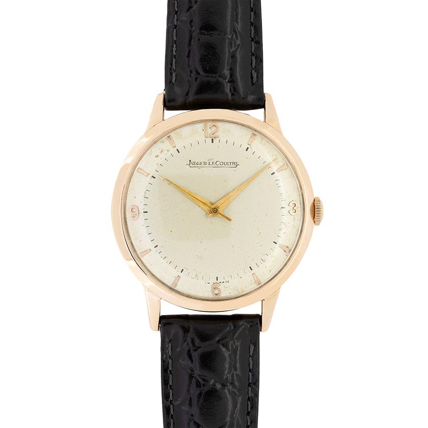 This Vintage dress watch comes from the master horologists at Jaeger-LeCoultre, The 14 carat rose gold case is 35mm in diameter and holds a manual winding movement. The patina on the original watch face shows the age of the piece beautifully. Arabic