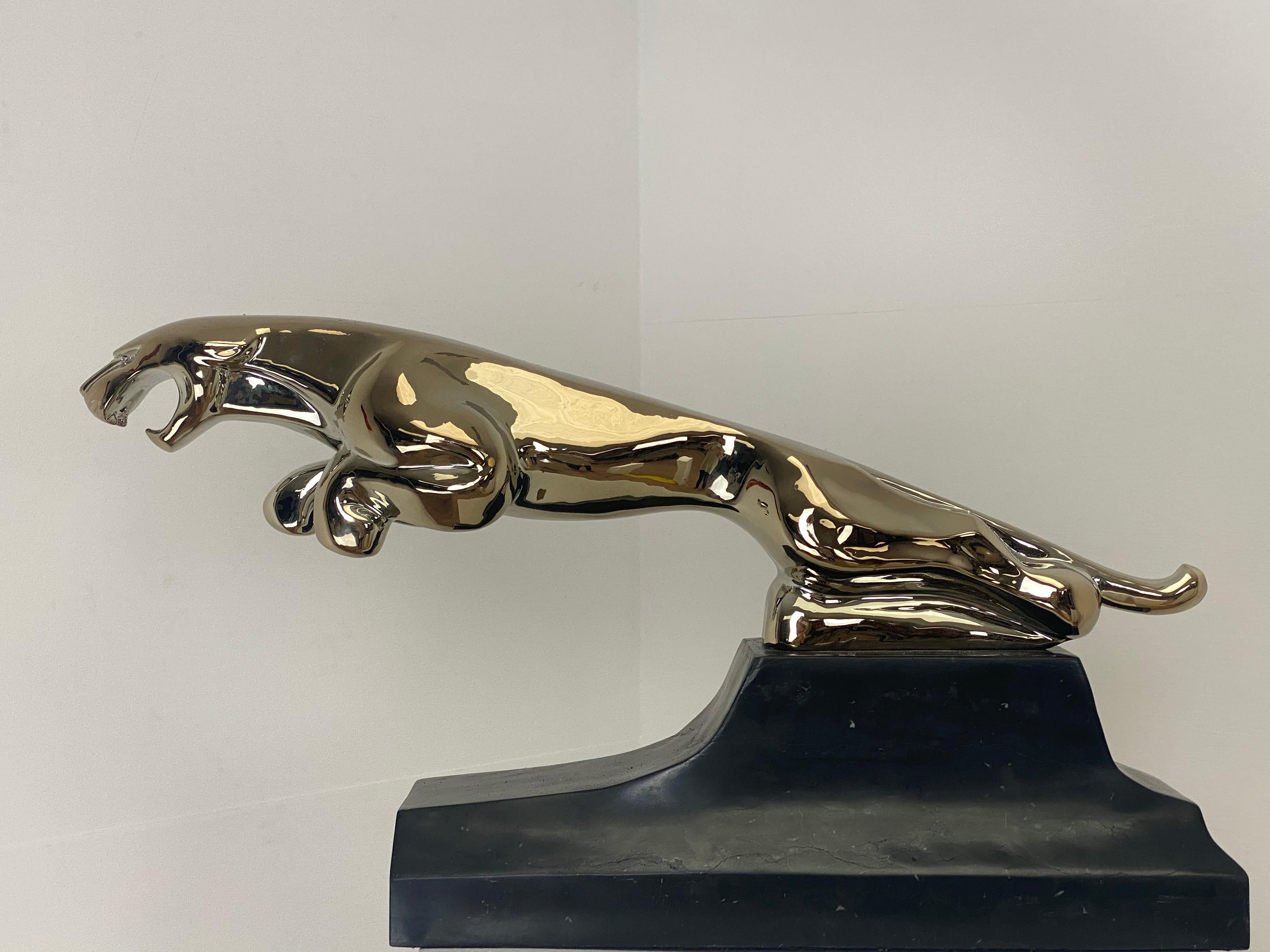 An XXL Vintage JAGUAR Car Emblem ,
exceptional object because of its size, beautiful patina and shine of the metal
and stone base,
the object comes from a Parisian based Jaguar Garage and was on the desk of the Garages Director,
a real Collectors