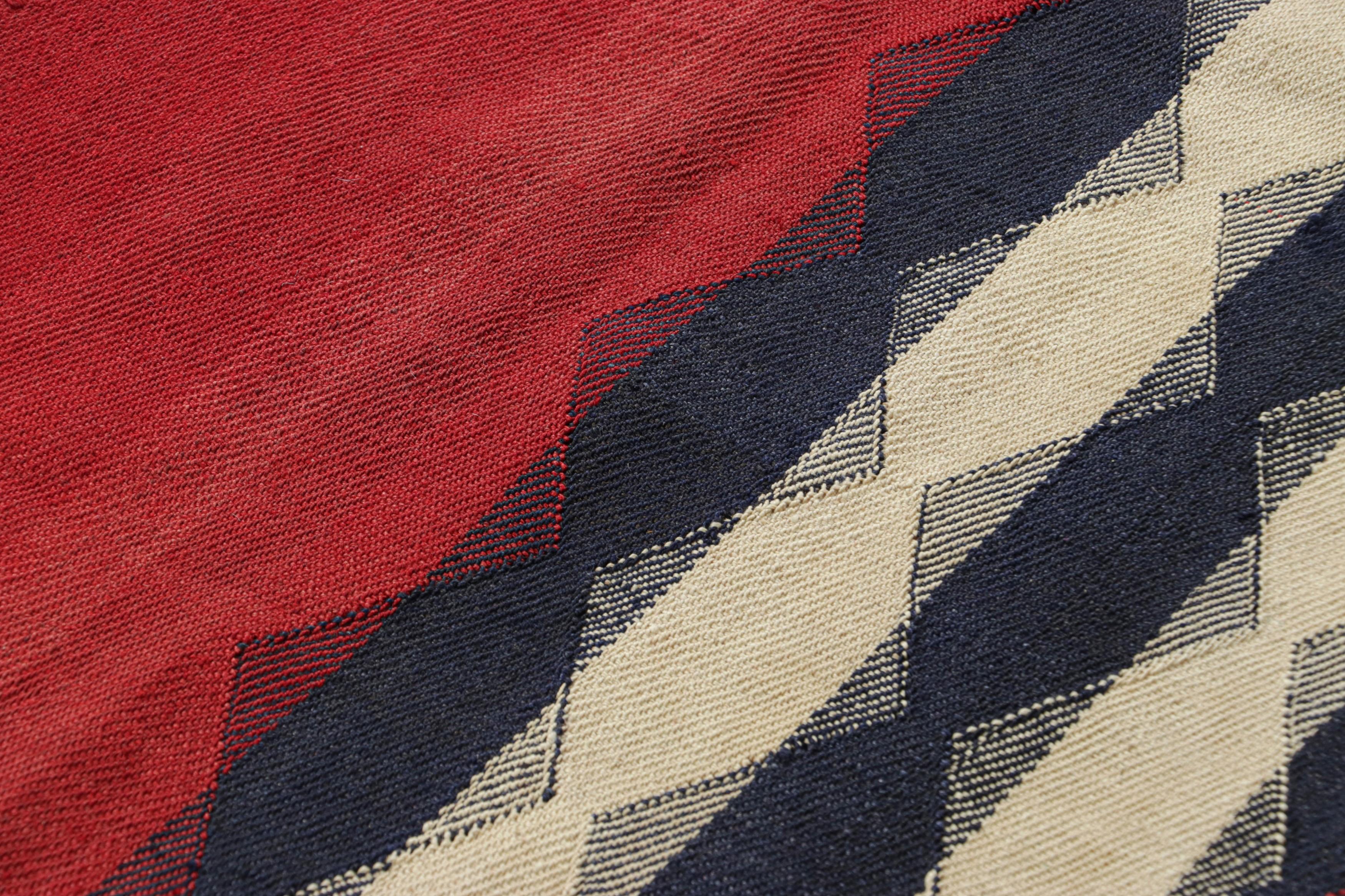 This vintage 5x7 Persian kilim is a mid-century Qashqai tribal rug, handwoven in wool circa 1950-1960.

On the Design: 

The mid-century Persian kilim is divided into vertically banded segments, each meticulously defined by a sequence of contrasting