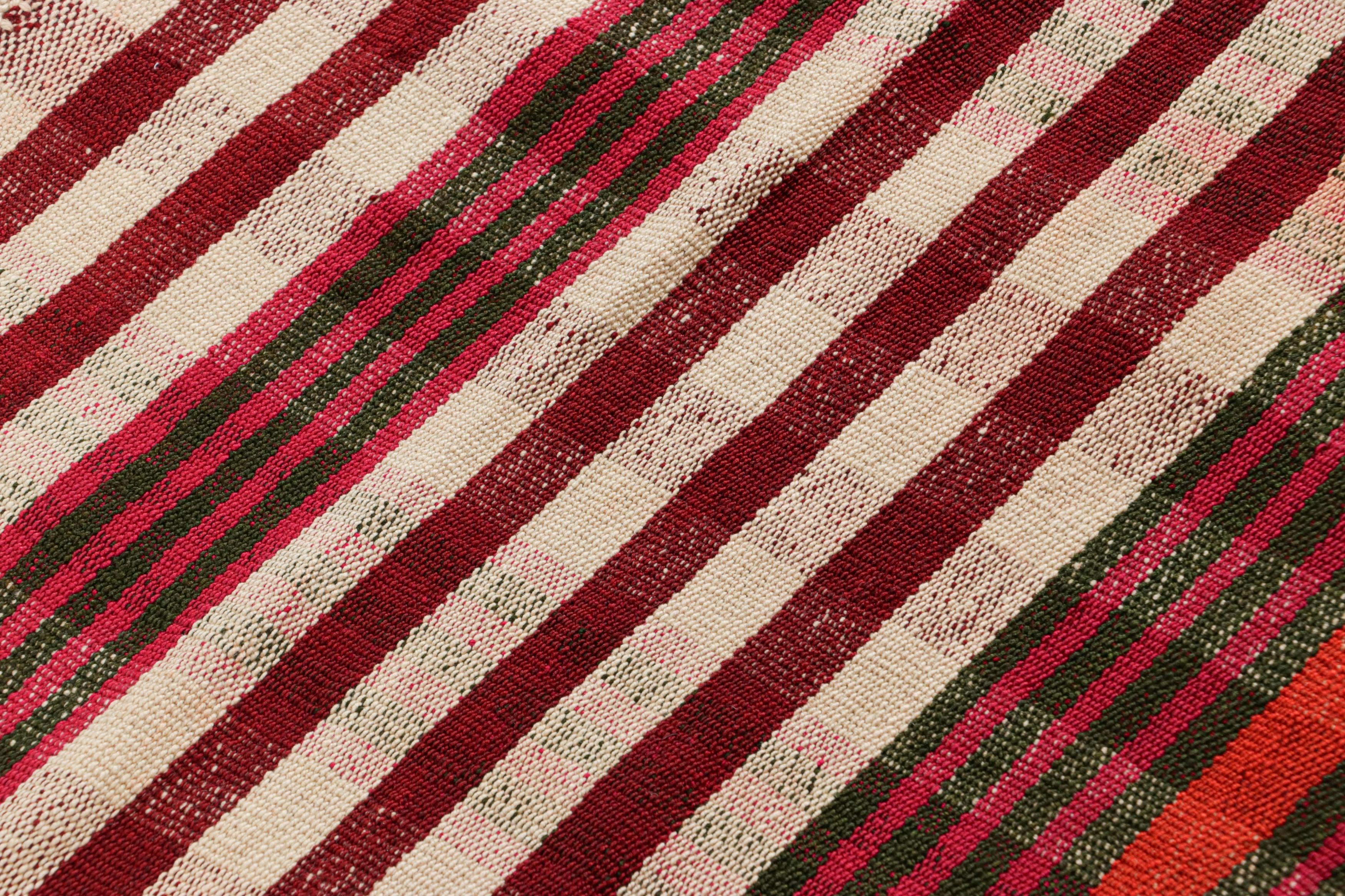 This vintage 5x6 Persian kilim is a mid-century Qashqai tribal rug, handwoven in wool circa 1950-1960.

On the Design: 

This mid-century Persian Jajim kilim presents a captivating interplay of stripes in a vivid palette of red, ivory, orange,