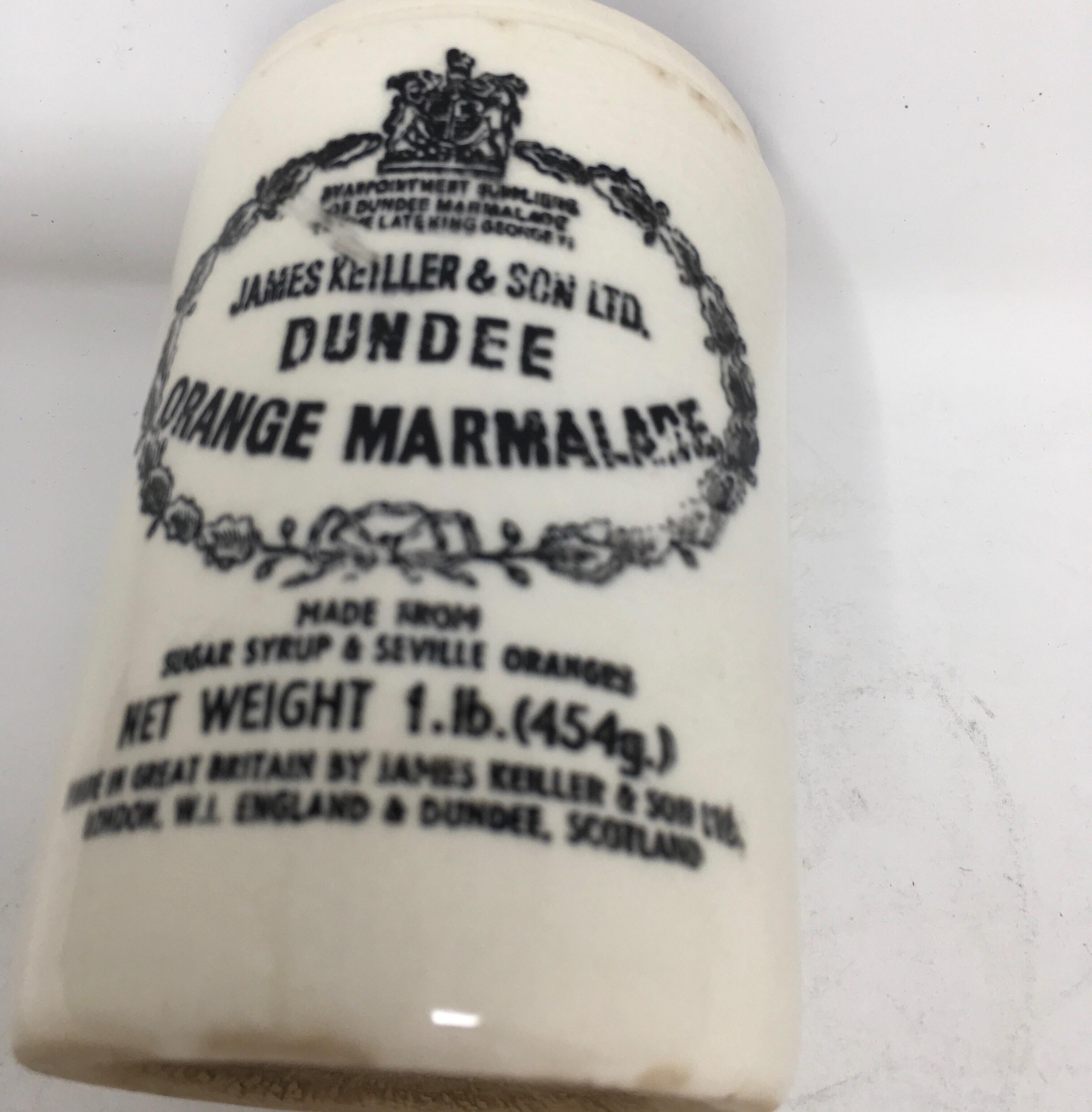 Found in England, this vintage Dundee ironstone orange marmalade advertising jar from Great Britain is in good clean condition. The decorative pot has transfer on the front in black lettering under the glaze. The transferred company logo is