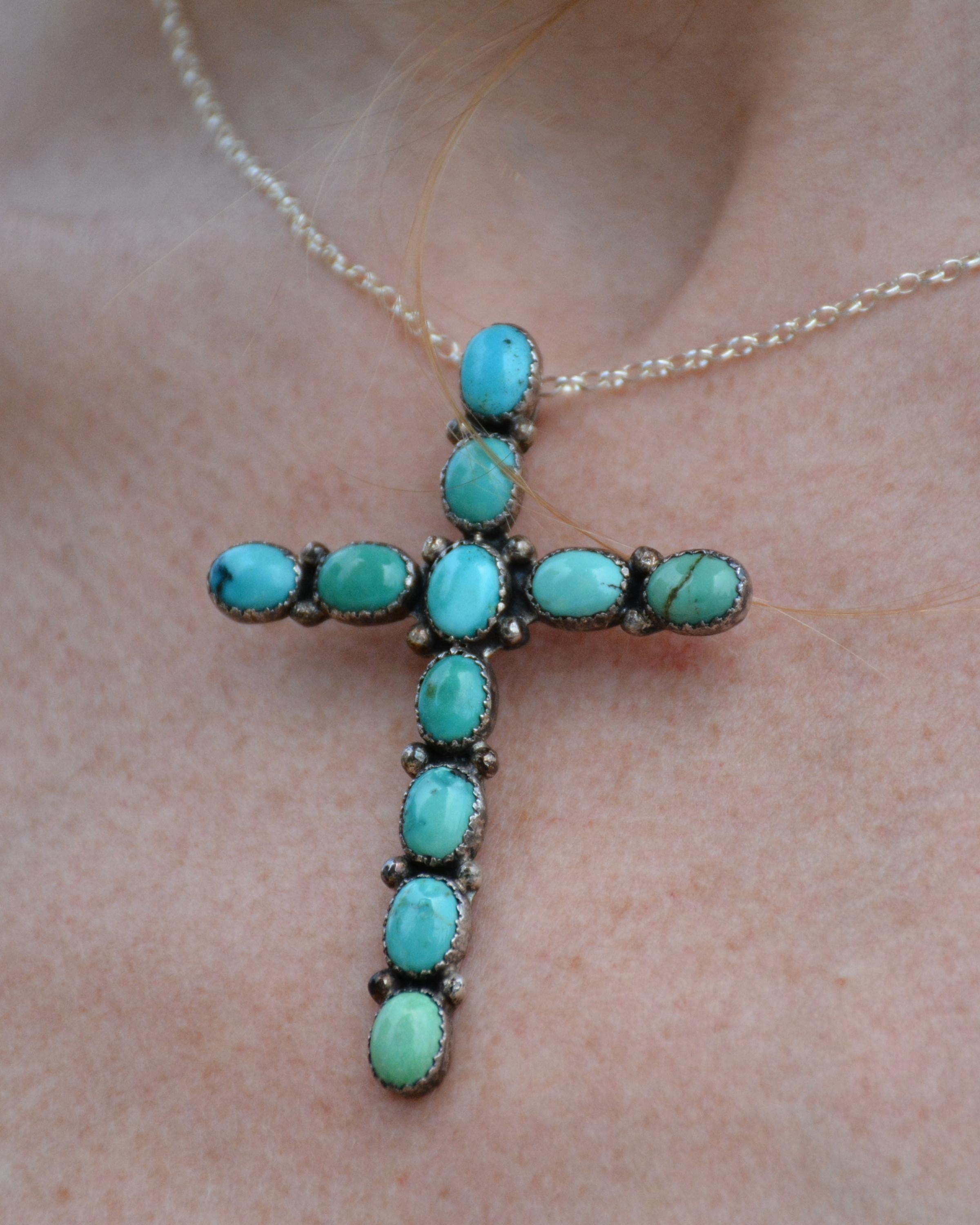 This artist-made vintage sterling silver and turquoise cross pendant was handcrafted by jewelry artist James Mason, whose pieces are highly collectible. It's beautifully made by hand, with turquoise stones set in scalloped bezels. The size is such a