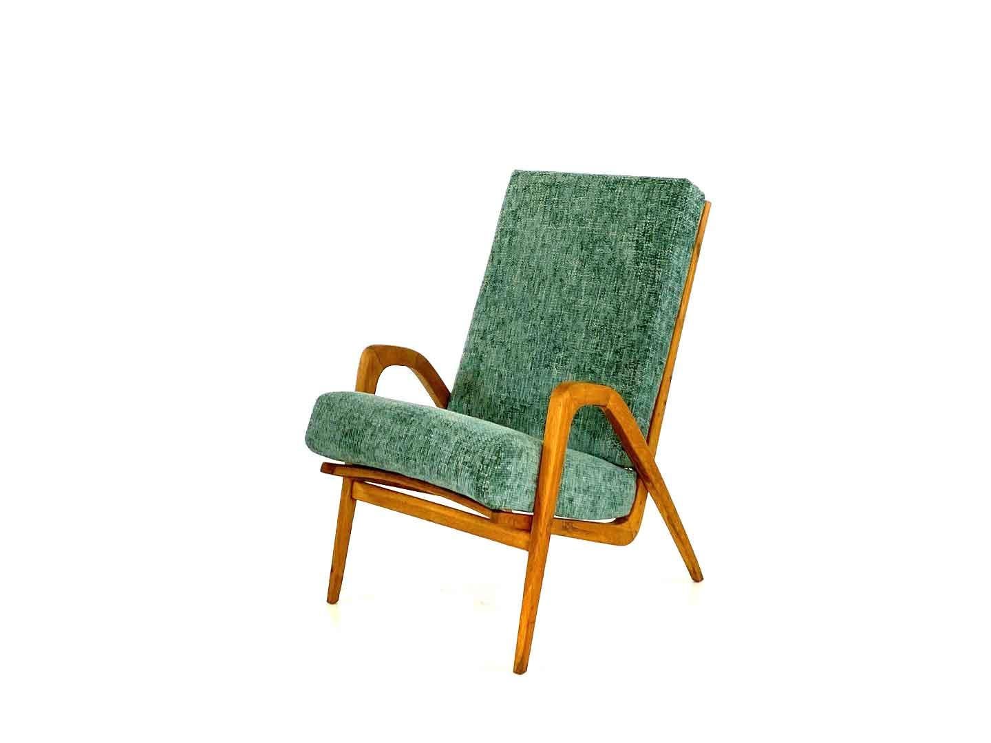 Unique vintage armchair designed by Jan Vanek for Úl'uv in the former Czecho-Slovakia in the 1960s. The oak minimalist frame provides great seating comfort and makes this armchair a true eyecatcher. The armchair has been reupholstered and is in