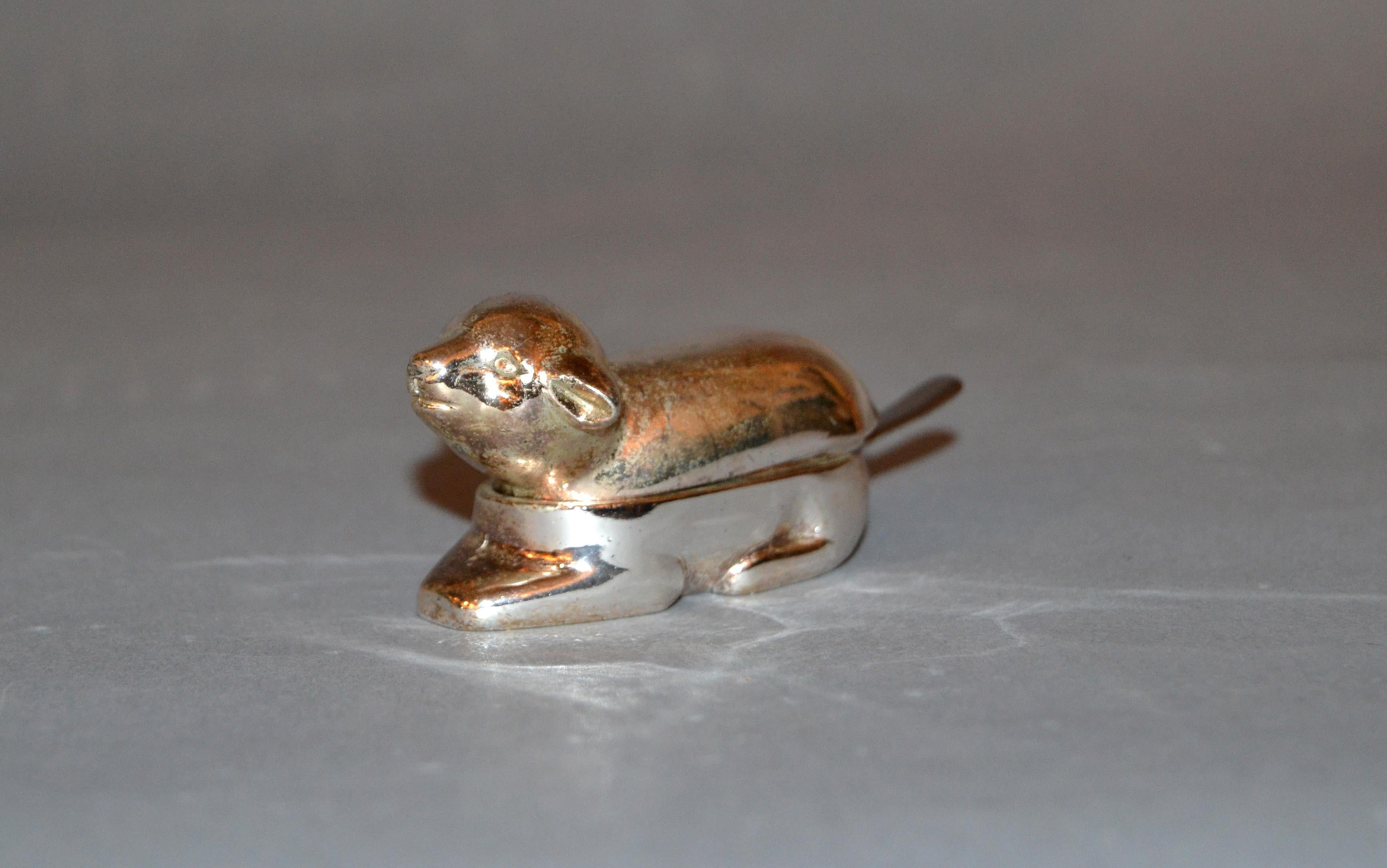 A vintage silver plate salt or spice dish designed as a sheep with a stainless steel spoon inside.
Label Made in Japan underneath and marked 18-8 at the spoon.
Makes the perfect timeless gift!