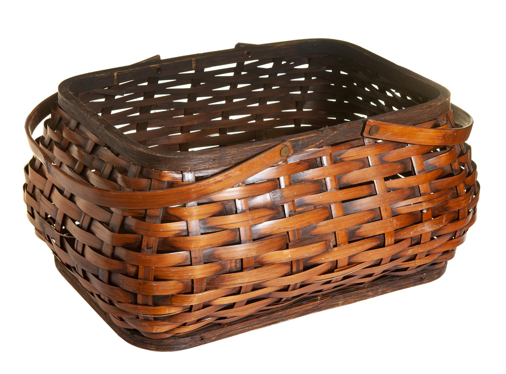 Burnished bamboo handwoven picnic basket with fitted lid with two handle attached with tiny brass hardware.